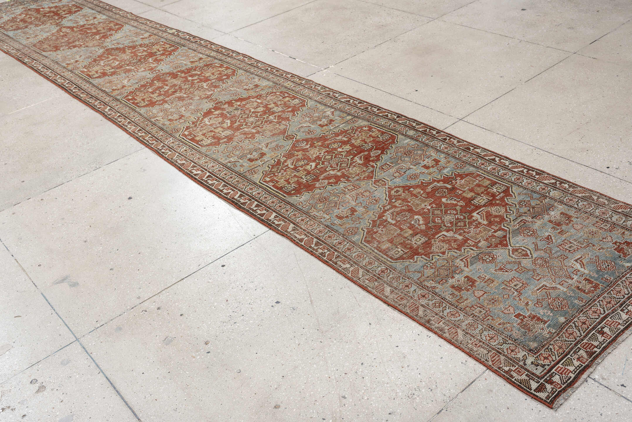 3' x 17' one-of-a-kind handmade vintage runner rug. Color palette: light blue, terracotta, ivory, taupe, camel, brown, beige