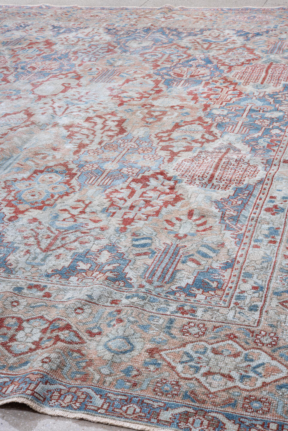 10' x 13' one-of-a-kind handmade vintage Baktiary large size rug. Color palette: ivory, sky blue, rust, coral, powder blue