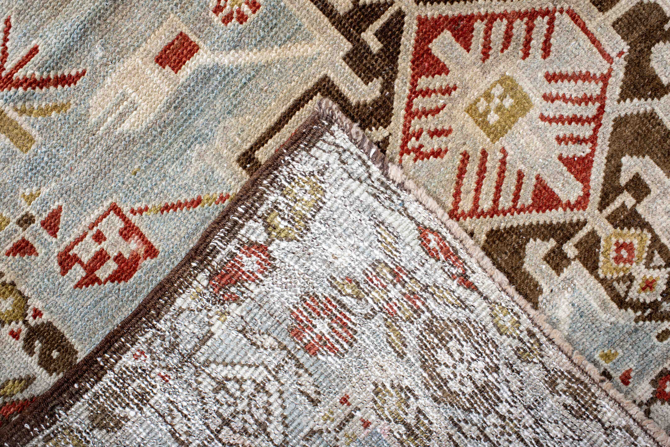 3' x 17' one-of-a-kind handmade antique Heriz runner rug. Color palette: light blue, ivory, rust, brown, camel, gold, taupe