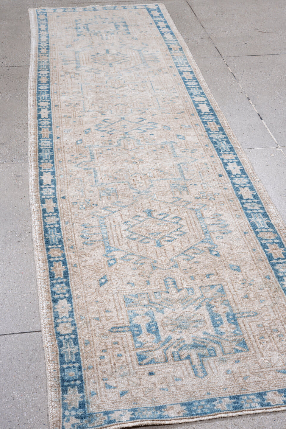 2' x 10' one-of-a-kind handmade vintage Karaje runner rug. Color palette: ivory, sky_blue, beige, taupe, camel, light blue
