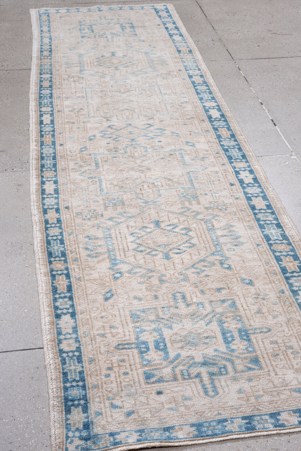 2' x 10' one-of-a-kind handmade vintage Karaje runner rug. Color palette: ivory, sky_blue, beige, taupe, camel, light blue