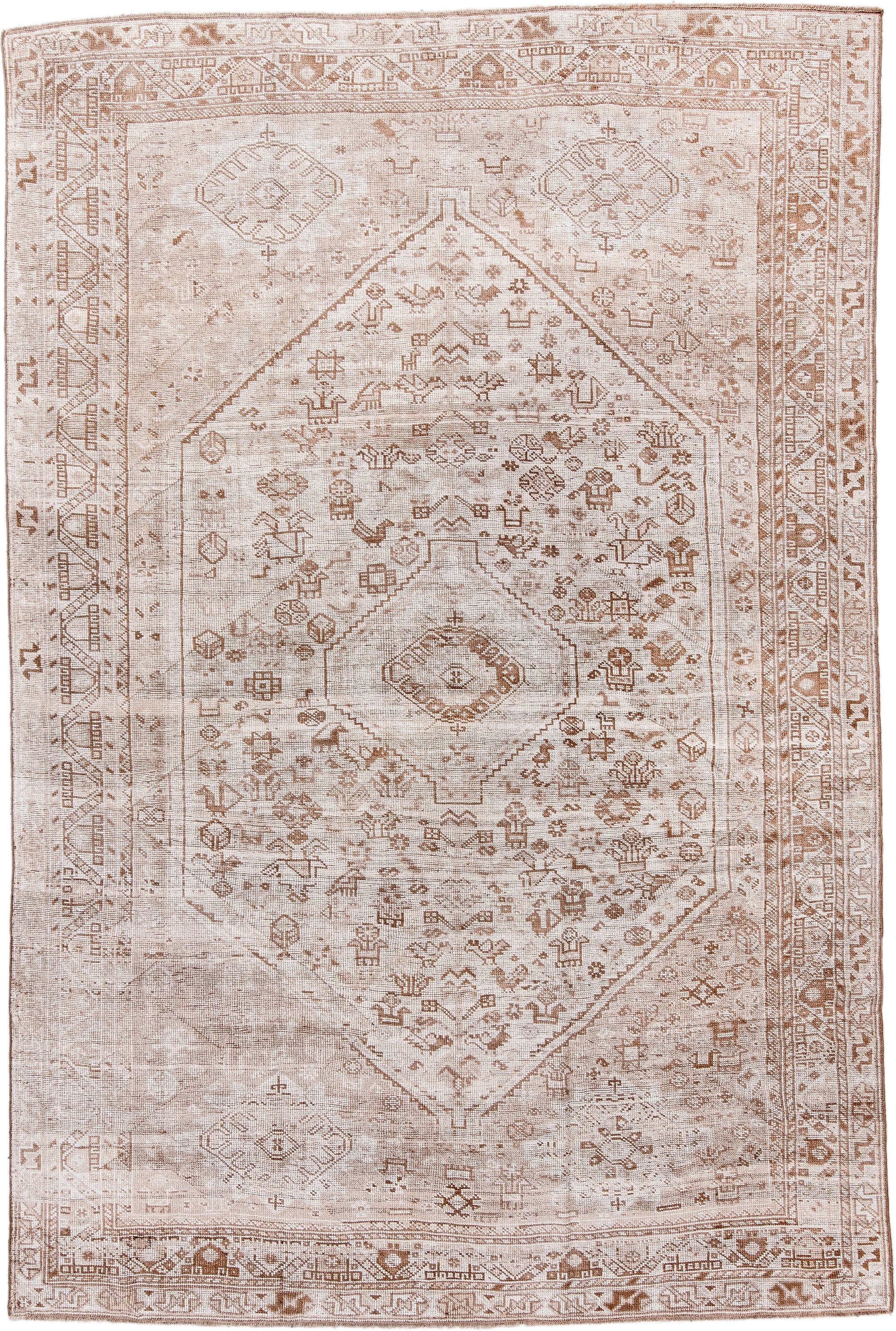 6' x 9' one-of-a-kind handmade antique Shiraz medium size rug. Color palette: ivory, taupe, camel, sand, light brown, beige