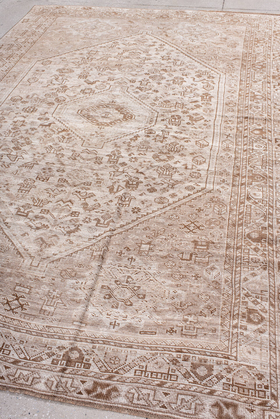 6' x 9' one-of-a-kind handmade antique Shiraz medium size rug. Color palette: ivory, taupe, camel, sand, light brown, beige