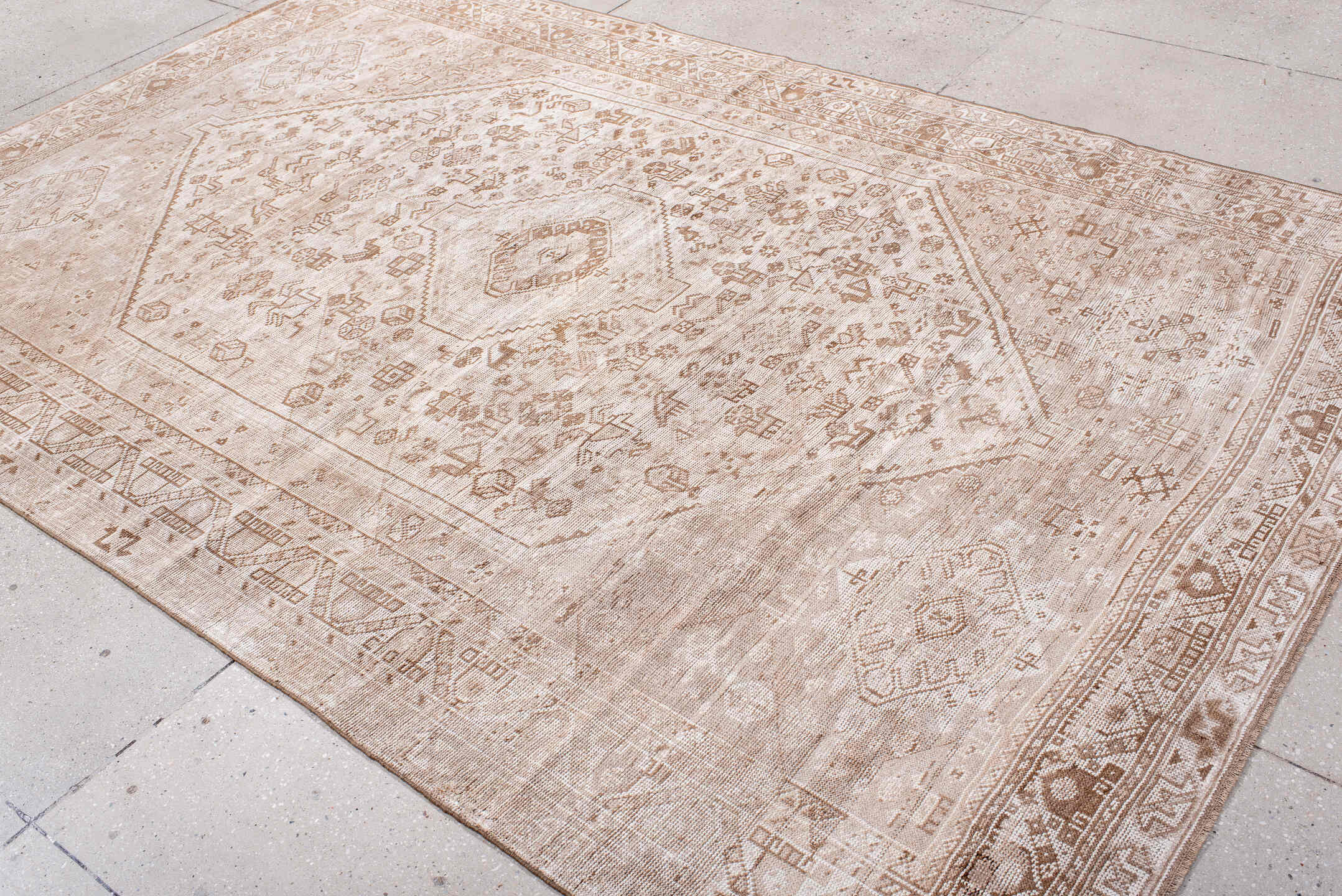 6' x 9' one-of-a-kind handmade antique Shiraz medium size rug. Color palette: ivory, taupe, camel, sand, light brown, beige