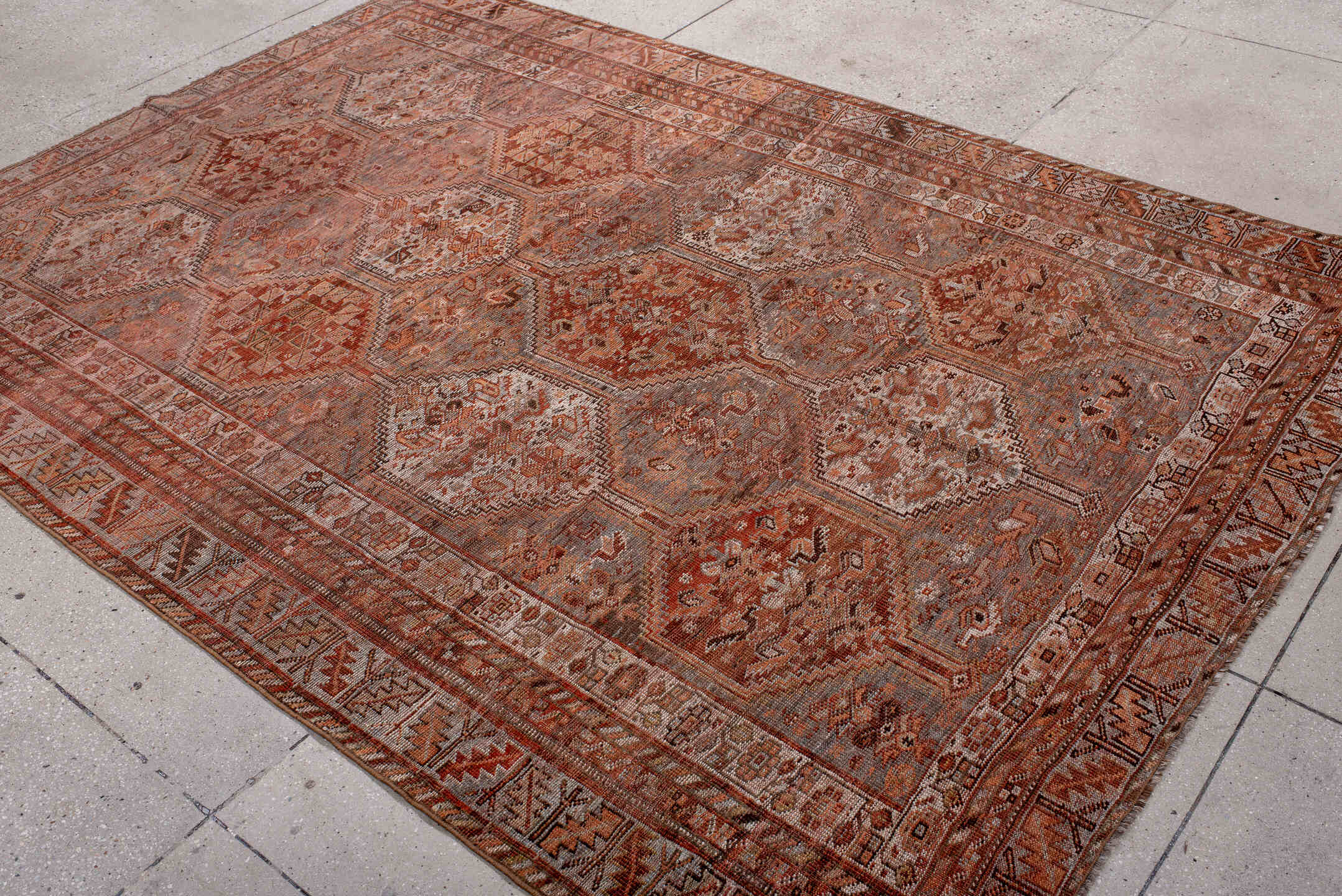 6' x 9' one-of-a-kind handmade antique Shiraz medium size rug. Color palette: rose, rust, terra cotta, ivory, taupe, brown