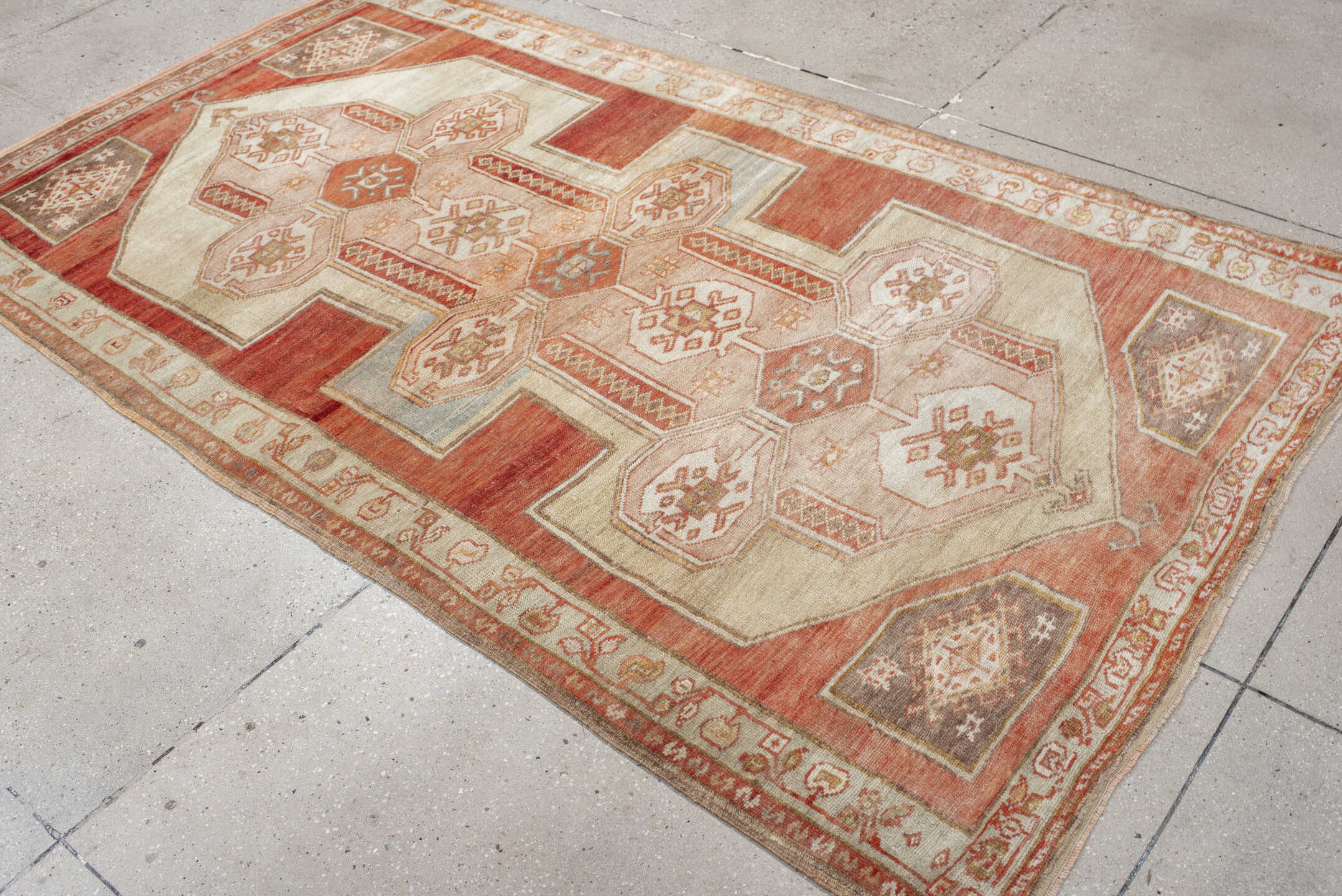 4' x 7' one-of-a-kind handmade vintage Anatolian rug. Color palette: ivory, terra cotta, rust, taupe, sage, camel, rose