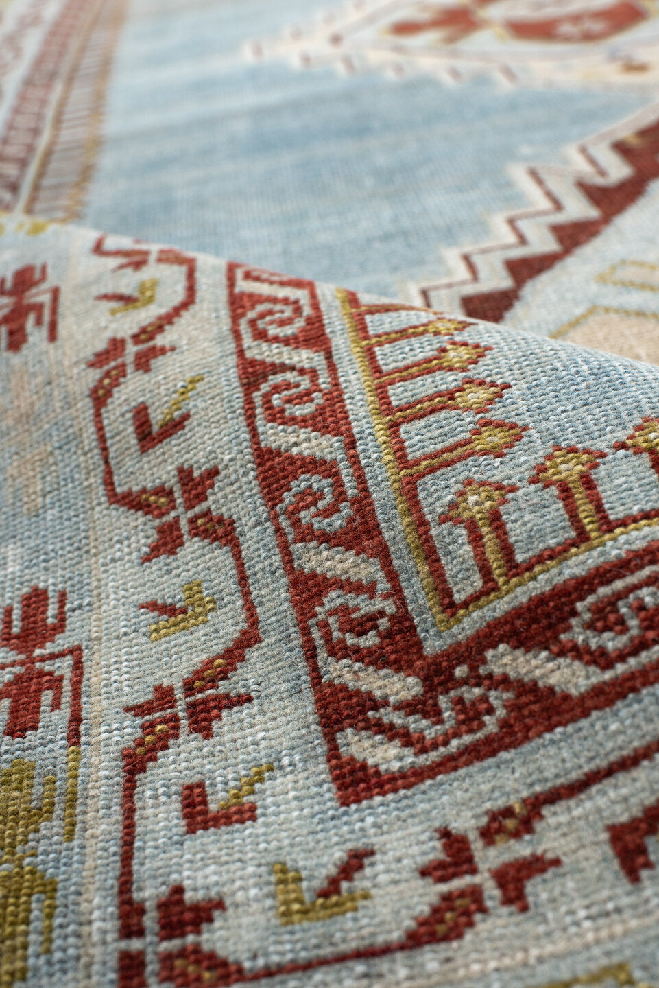 3' x 6' one-of-a-kind handmade antique Kuba small size rug. Color palette: light blue, ivory, rust, brown, gold, terracotta