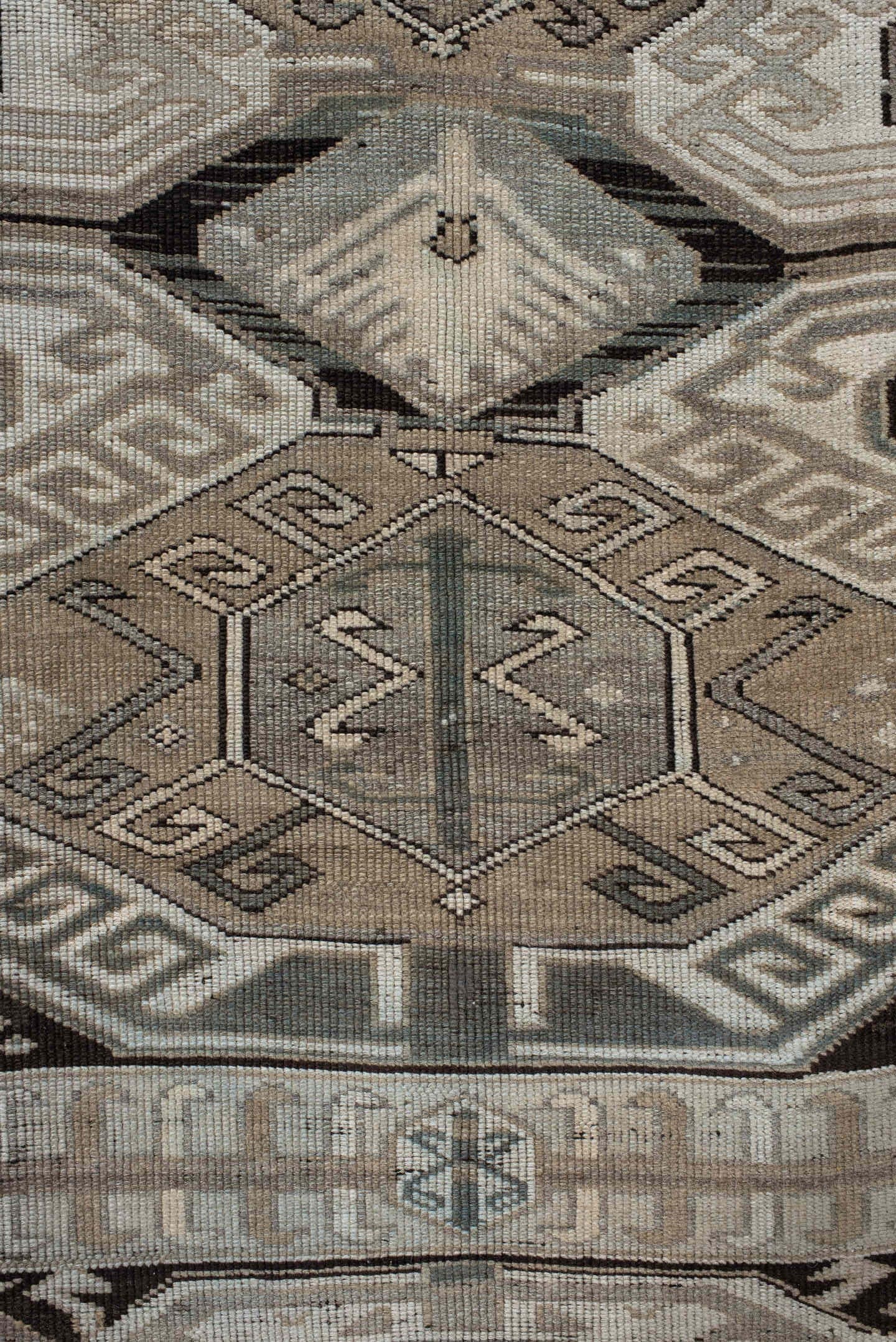 4' x 10' one-of-a-kind handmade antique Caucasian runner rug. Color palette: ivory, charcoal, taupe, brown, slate, gray