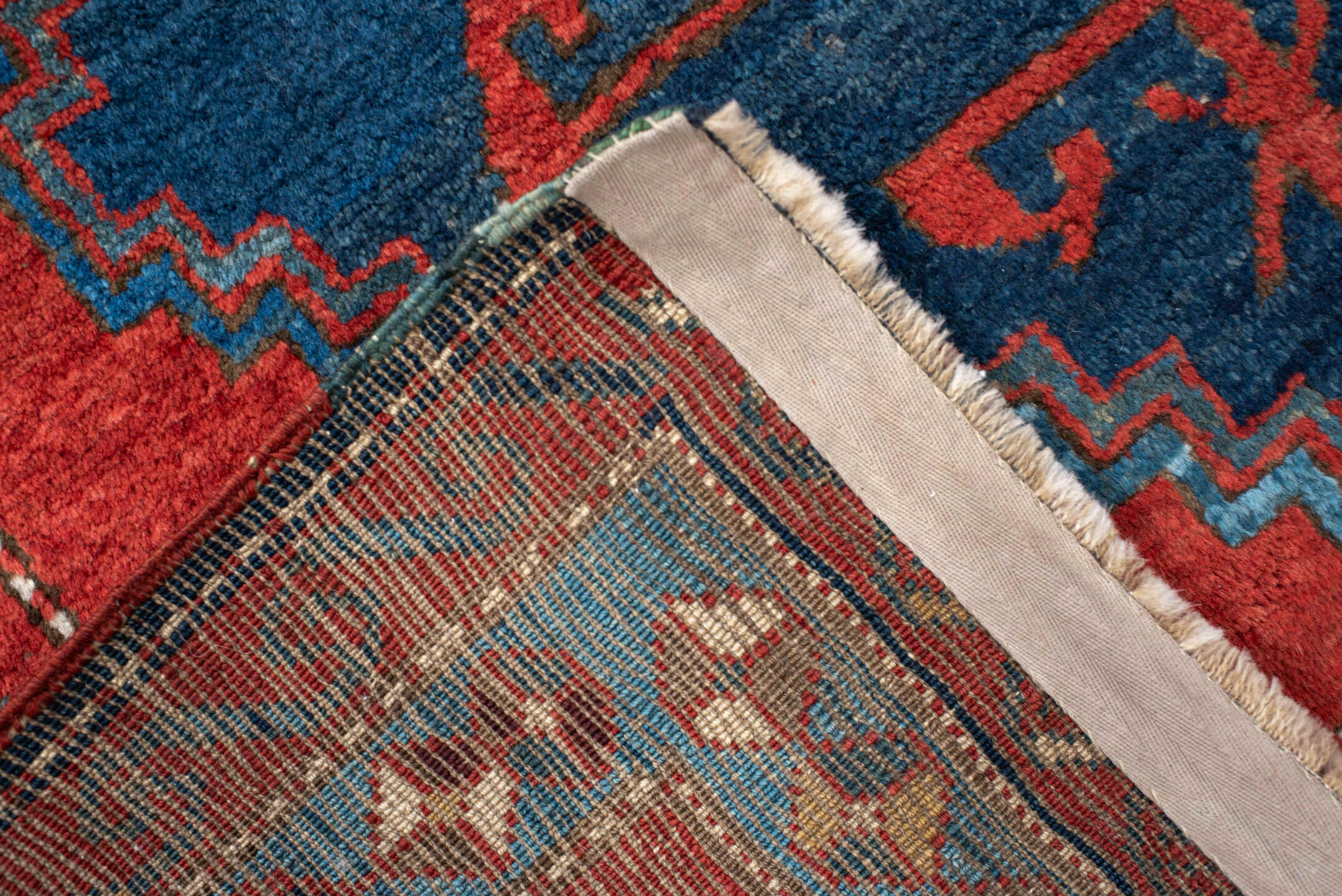 4' x 6' one-of-a-kind handmade antique Kazak small size rug. Color palette: rust, navy, sky_blue, ivory, brick, teal