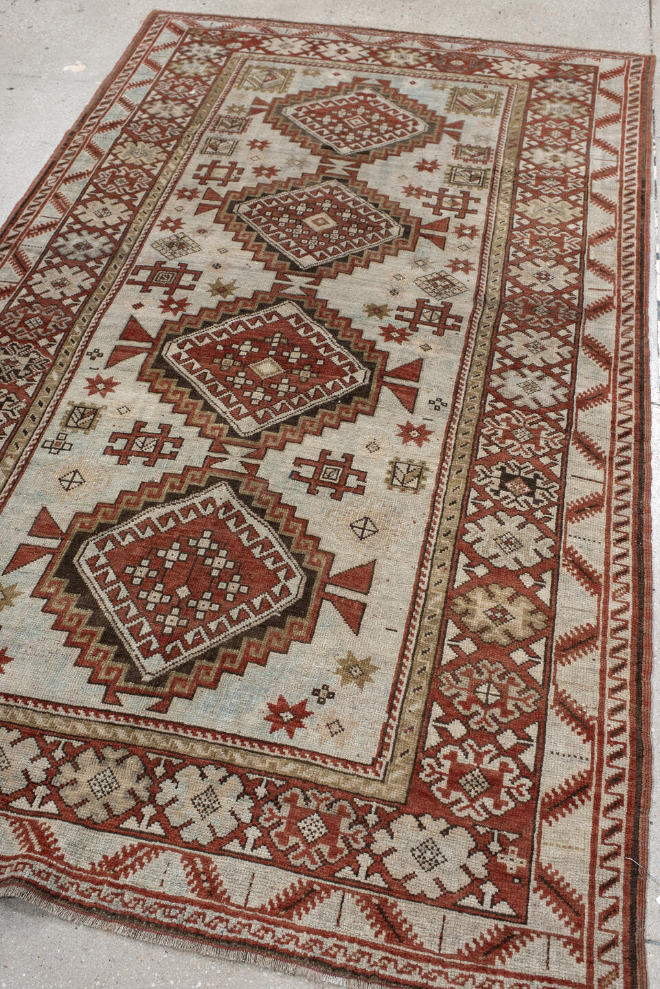 4' x 8' one-of-a-kind handmade vintage Caucasian medium size rug. Color palette: ivory, rust, taupe, brown, charcoal, beige