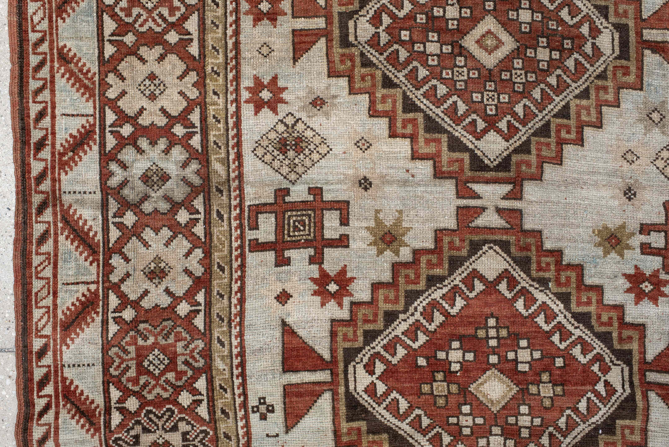4' x 8' one-of-a-kind handmade vintage Caucasian medium size rug. Color palette: ivory, rust, taupe, brown, charcoal, beige