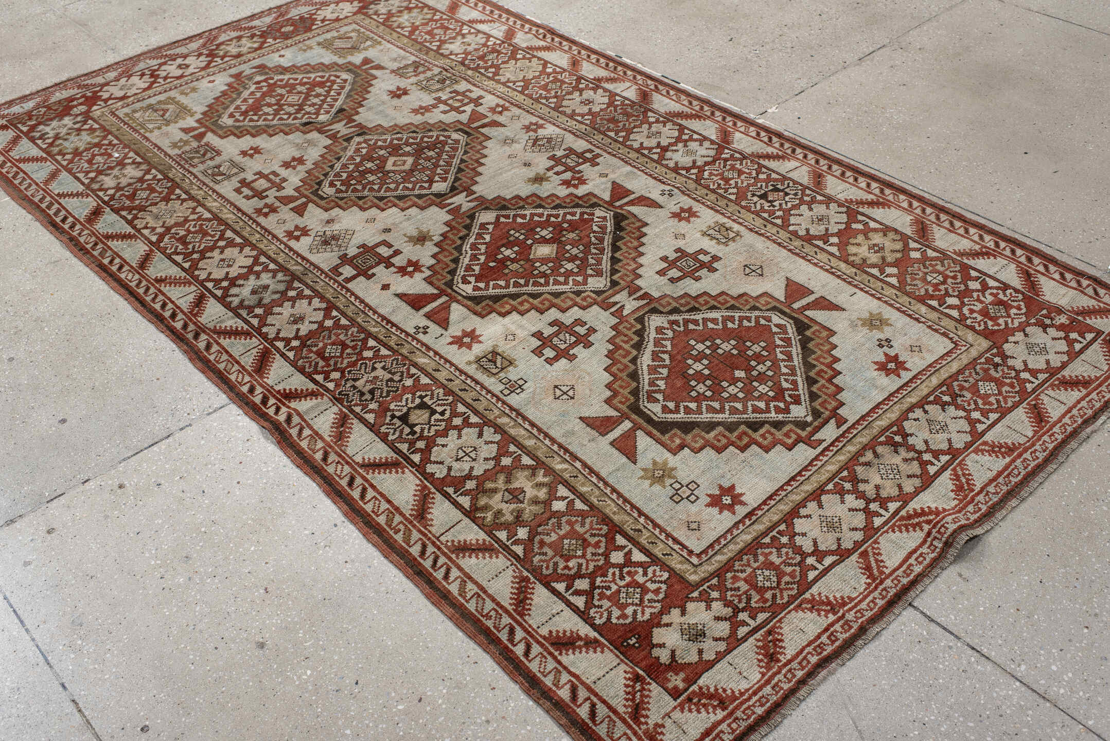 4' x 8' one-of-a-kind handmade vintage Caucasian medium size rug. Color palette: ivory, rust, taupe, brown, charcoal, beige