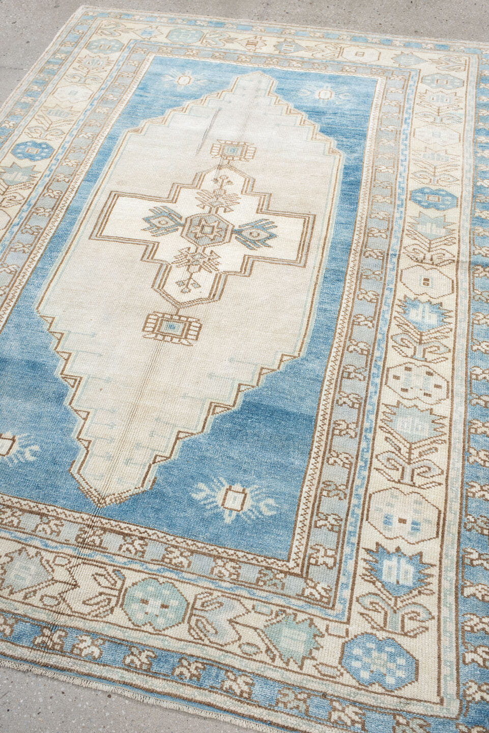 4' x 7' one-of-a-kind handmade vintage Anatolian rug. Color palette: ivory, sky blue, beige, taupe, camel, light blue, gray