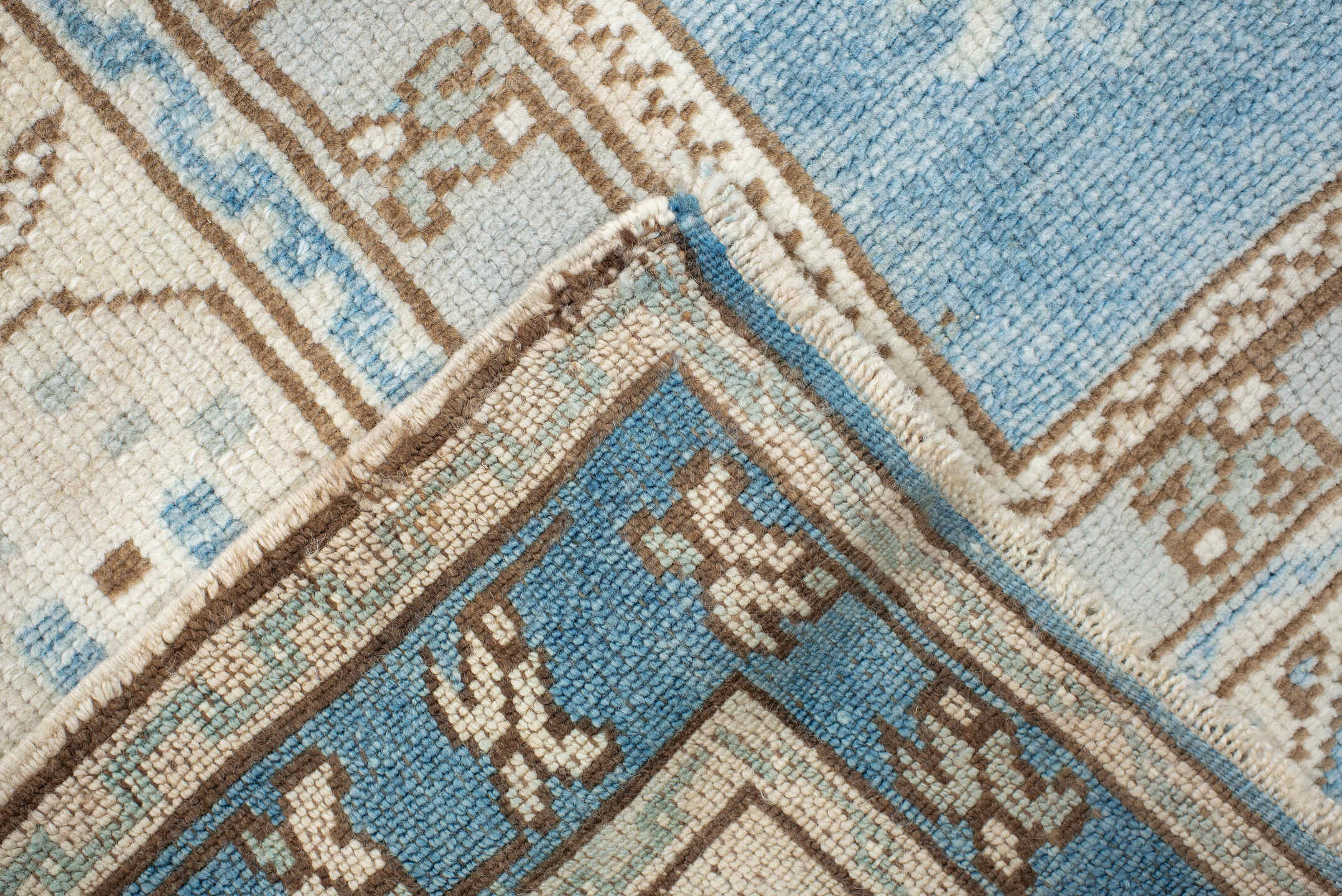 4' x 7' one-of-a-kind handmade vintage Anatol rug. Color palette: brown, dark gray, gainsboro, gray, light blue, light gray