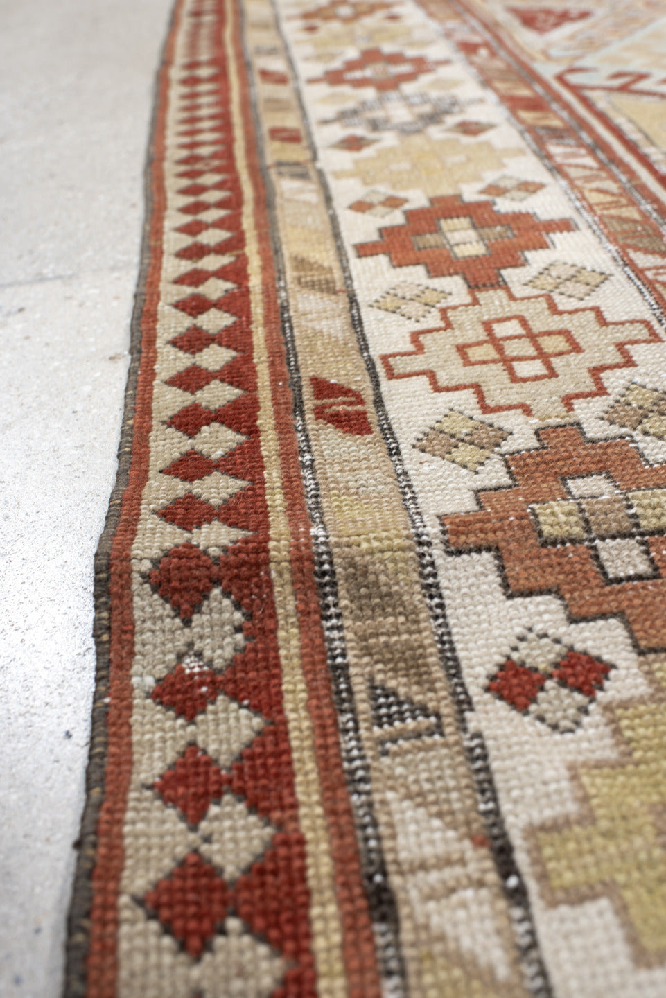 3' x 8' one-of-a-kind handmade antique Caucasian runner rug. Color palette: ivory, sky blue, rust, burgundy, camel, taupe