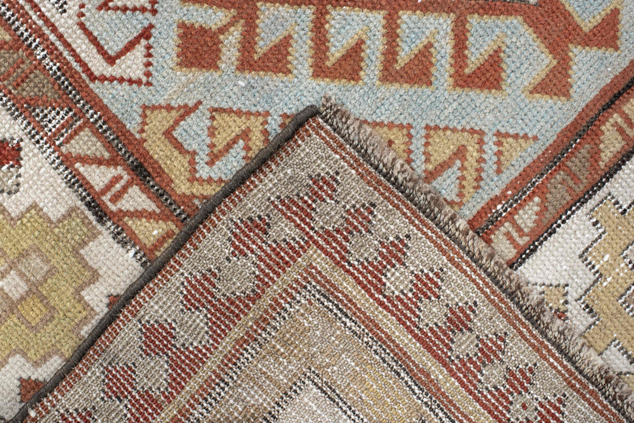 3' x 8' one-of-a-kind handmade antique Caucasian runner rug. Color palette: ivory, sky blue, rust, burgundy, camel, taupe