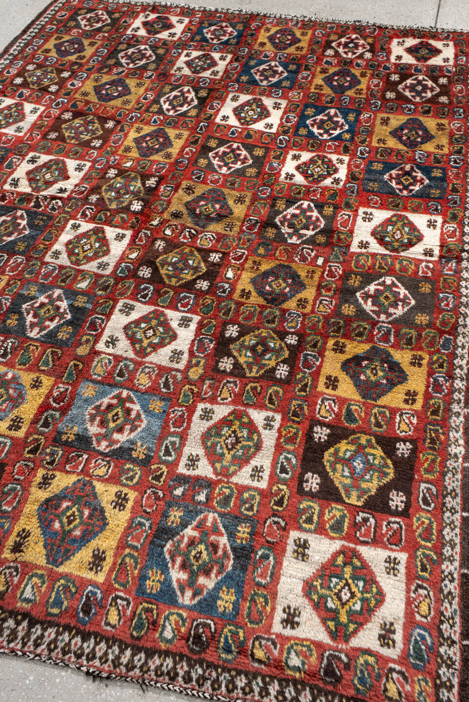 5' x 7' one-of-a-kind handmade vintage Gabbe rug. Color palette: rust, ivory, navy, camel, brown, teal, gold, charcoal