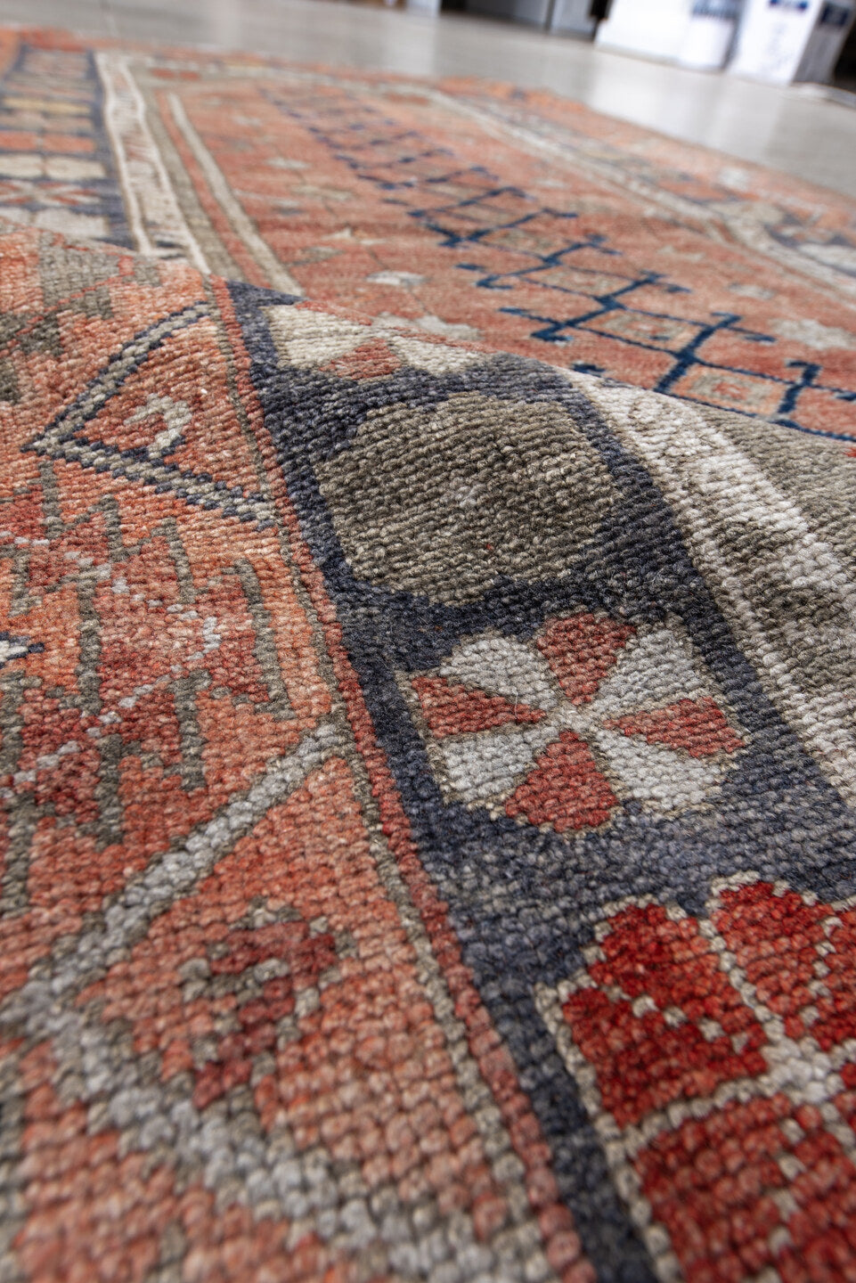 4' x 6' one-of-a-kind handmade antique Anatolian rug. Color palette: coral, gray, navy, ivory, rust, taupe, terracotta, blue