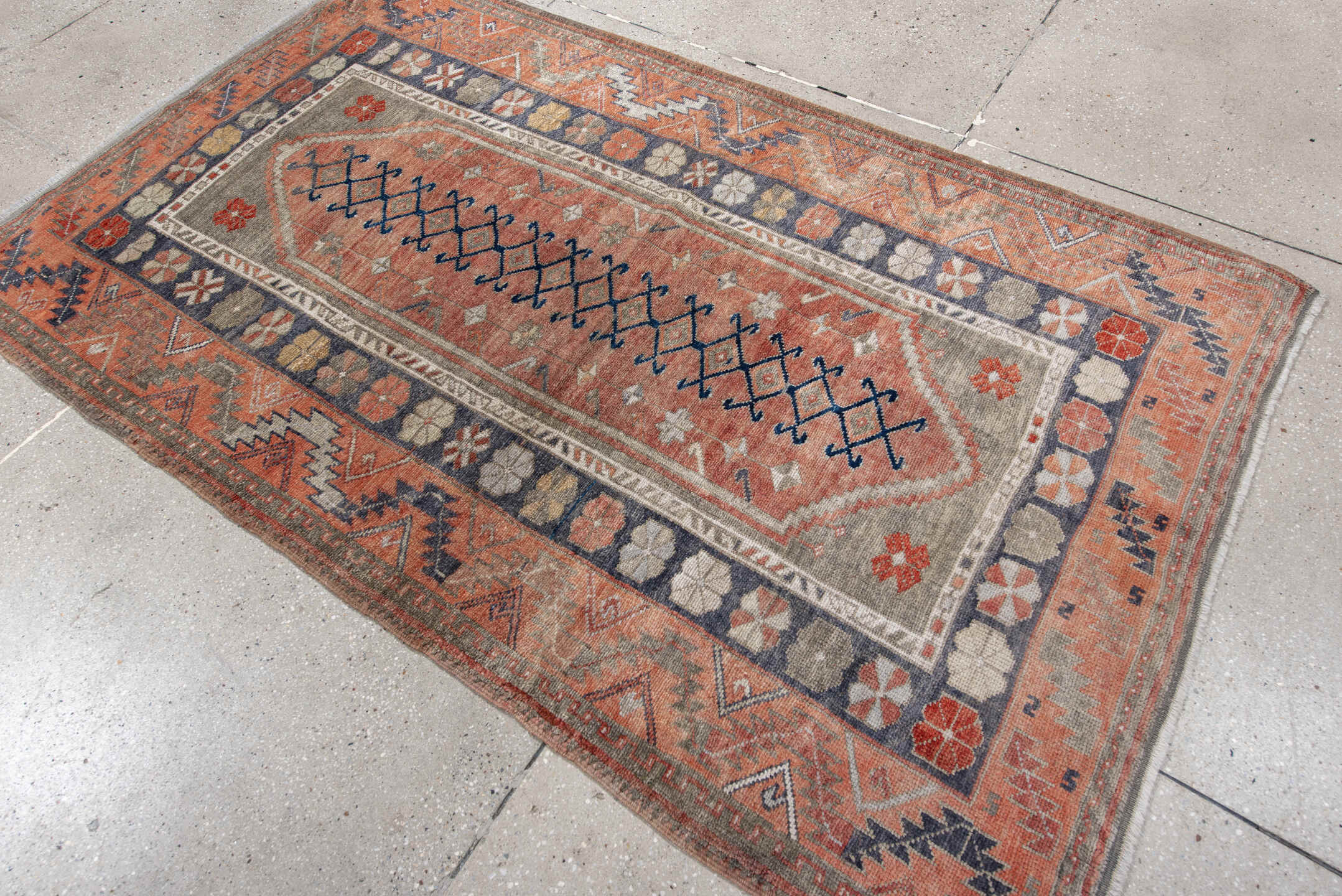 4' x 6' one-of-a-kind handmade antique Anatolian rug. Color palette: coral, gray, navy, ivory, rust, taupe, terracotta, blue