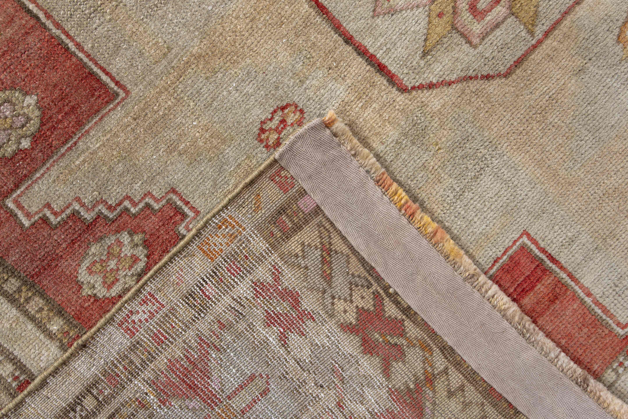 4' x 8' one-of-a-kind handmade vintage Anatol rug. Color palette: brown, gray, light gray, off-white, orange, pink, red