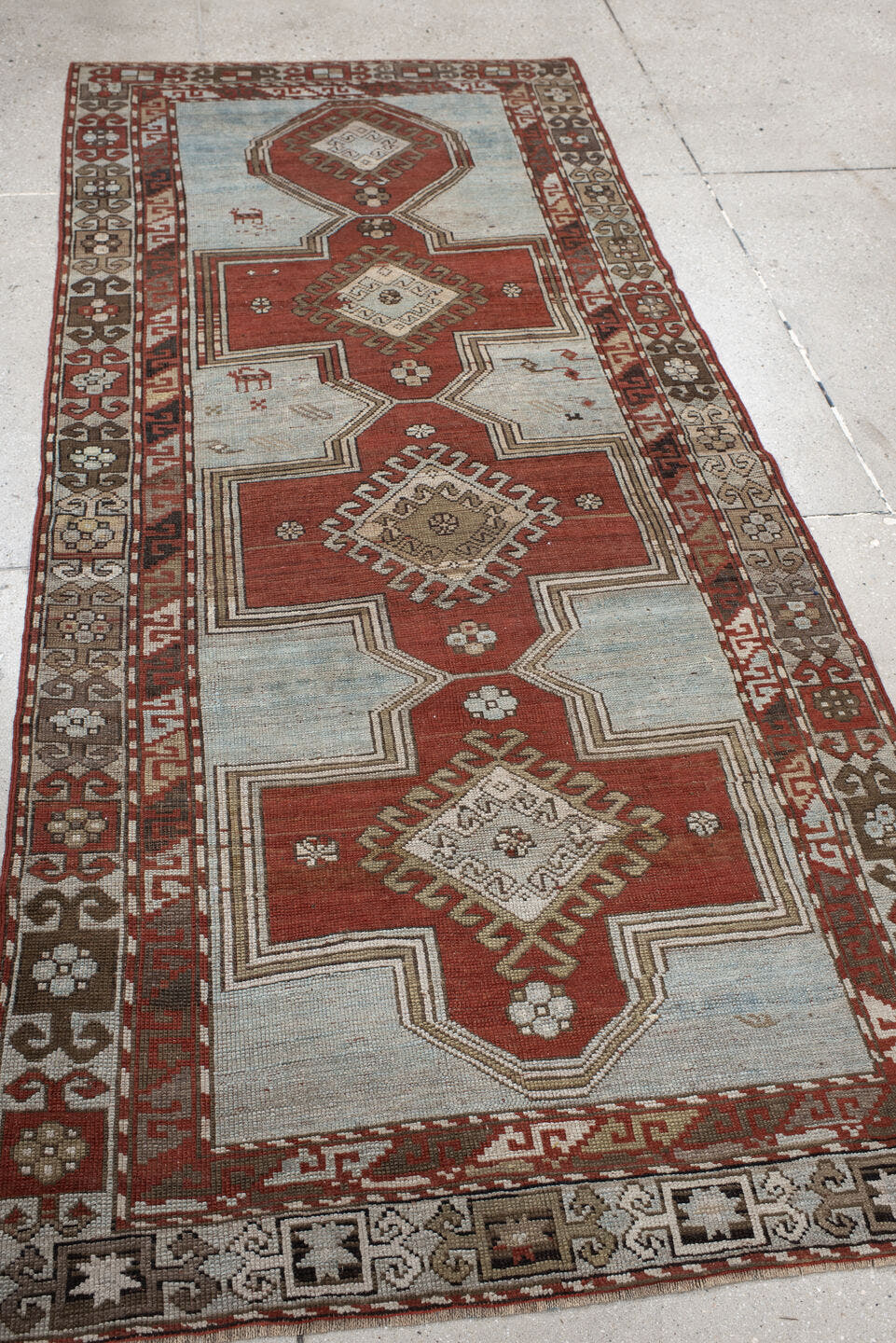 3' x 8' one-of-a-kind handmade vintage Caucasian runner rug. Color palette: ivory, rust, taupe, brown, crimson, charcoal