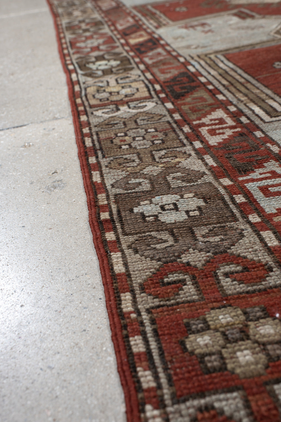 3' x 8' one-of-a-kind handmade vintage Caucasian runner rug. Color palette: ivory, rust, taupe, brown, crimson, charcoal