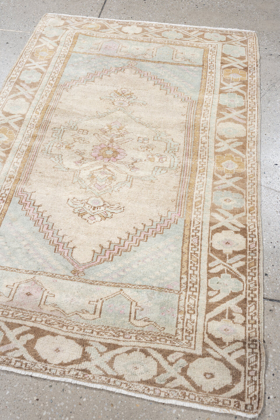 2' x 4' one-of-a-kind handmade antique Anatolian small size rug. Color palette: ivory, camel, pale blue, blush, taupe, beige