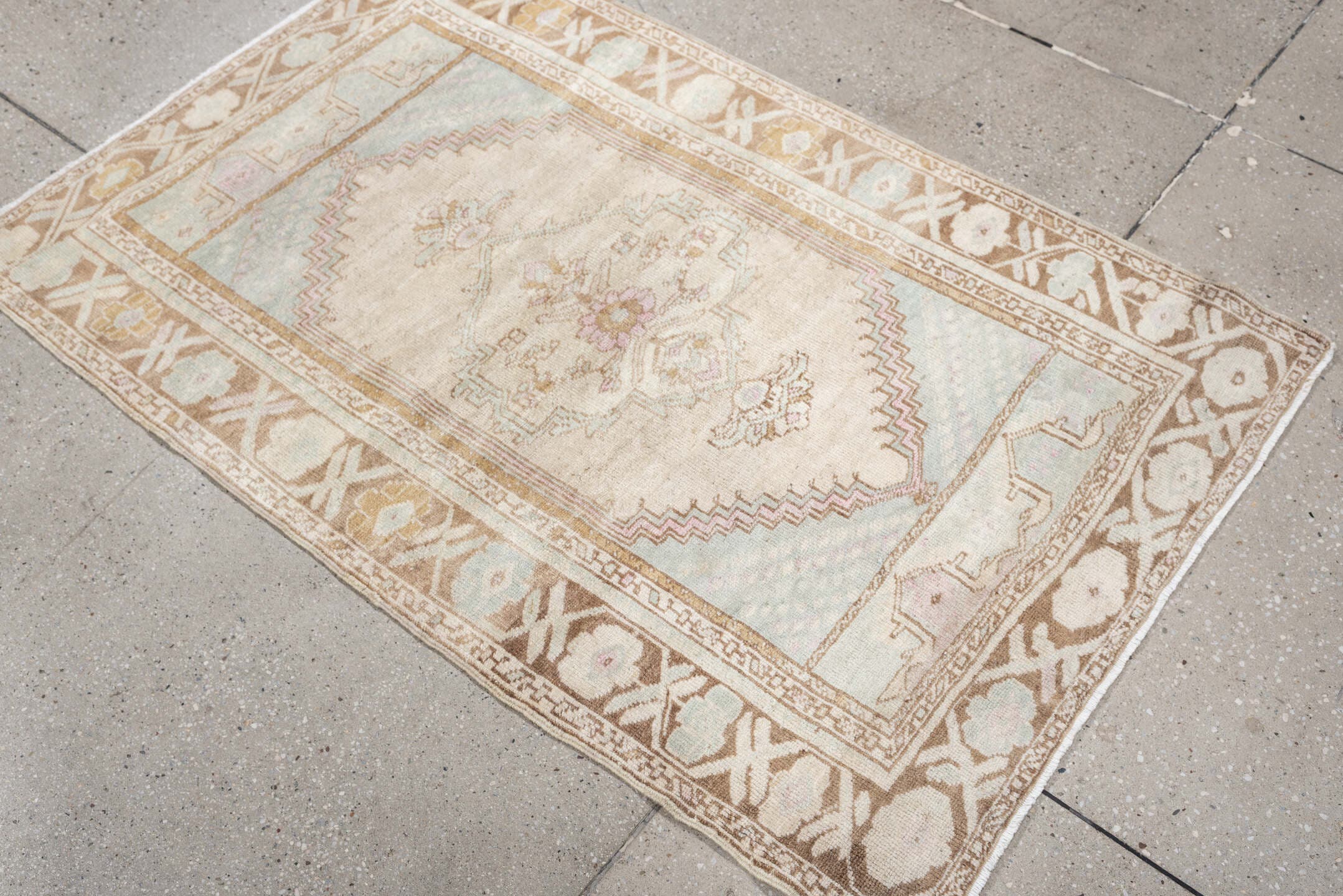 2' x 4' one-of-a-kind handmade antique Anatolian small size rug. Color palette: ivory, camel, pale blue, blush, taupe, beige