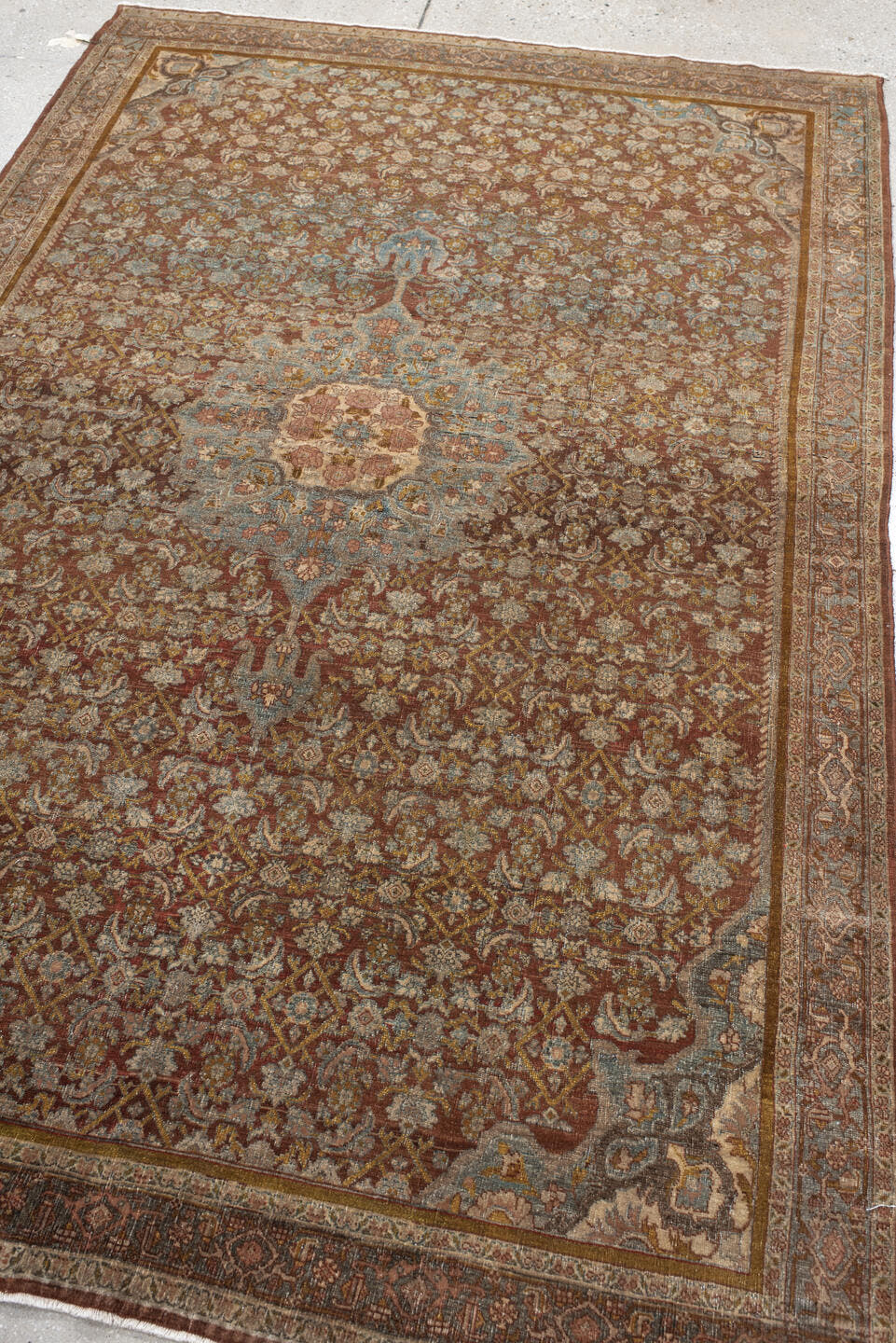 4' x 7' one-of-a-kind handmade vintage Bidjar rug. Color palette: rust, ivory, pale blue, taupe, rose, gold, brown