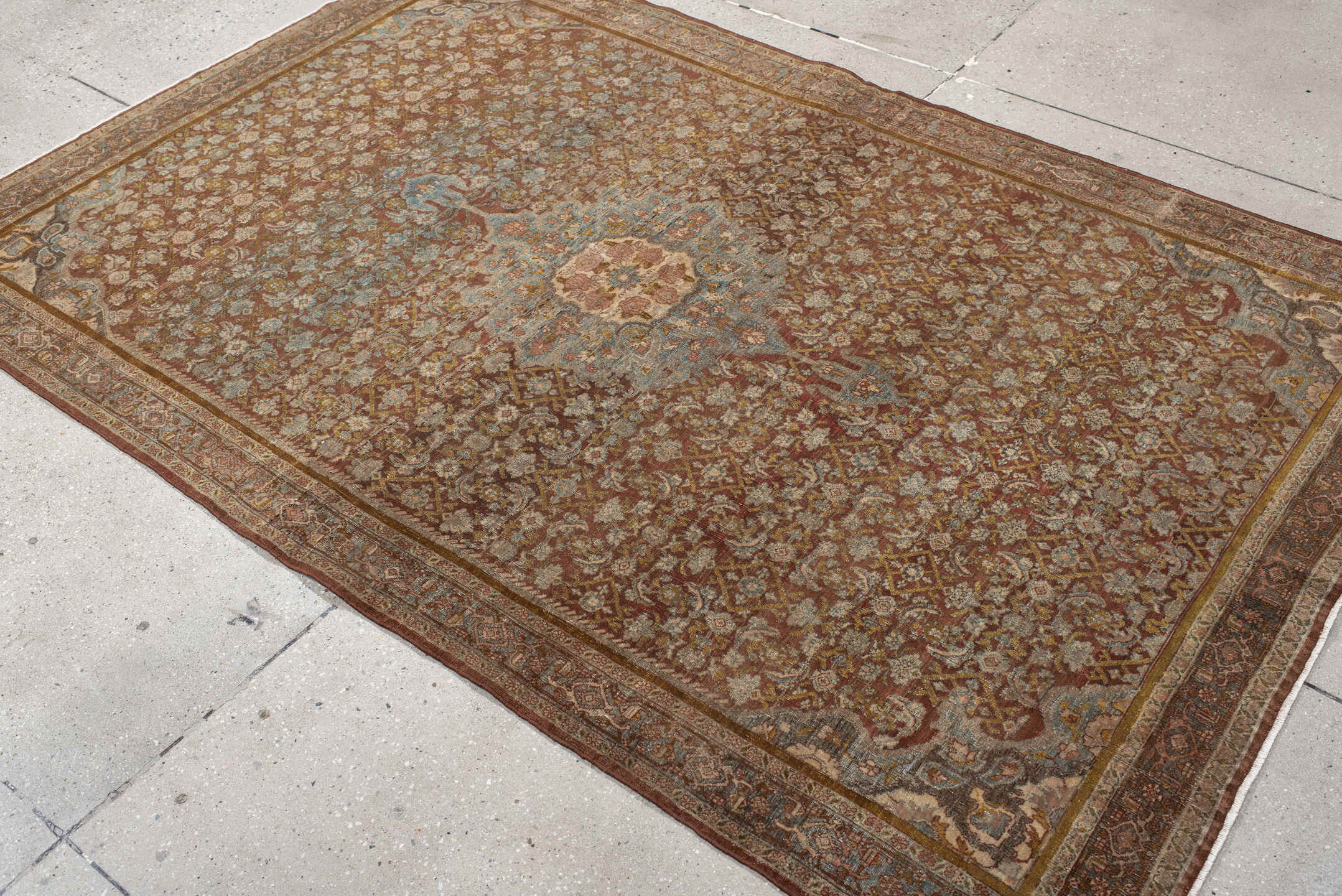 4' x 7' one-of-a-kind handmade vintage Bidjar rug. Color palette: rust, ivory, pale blue, taupe, rose, gold, brown