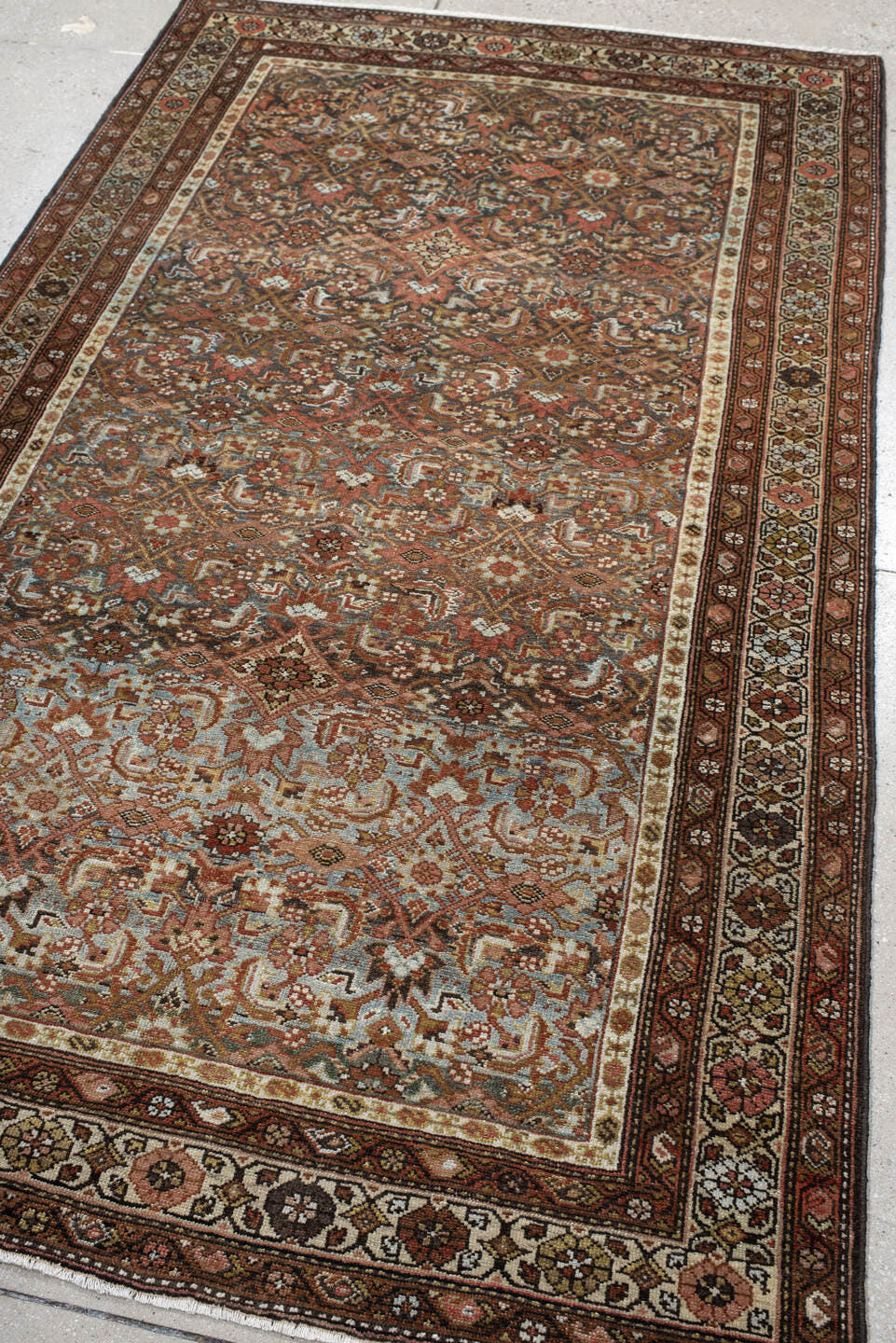 4' x 7' one-of-a-kind handmade antique Malayer rug. Color palette: rust, ivory, brown, sky blue, camel, charcoal, rose, gold