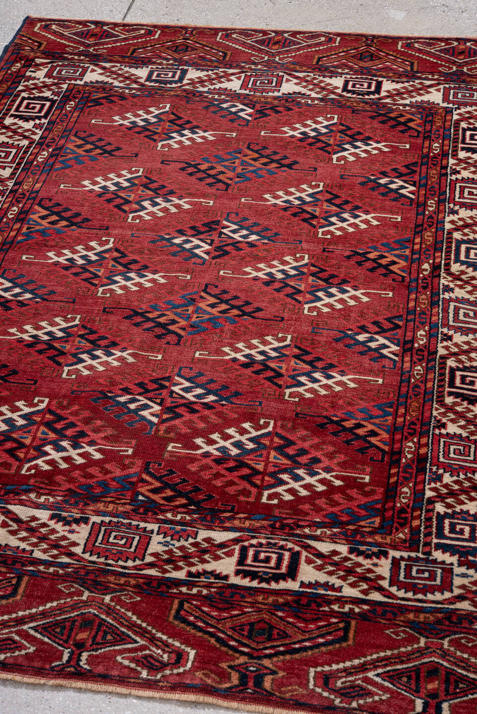 4' x 5' one-of-a-kind handmade vintage Bokara small size rug. Color palette: red, ivory, navy, burgundy, rust, cobalt, black