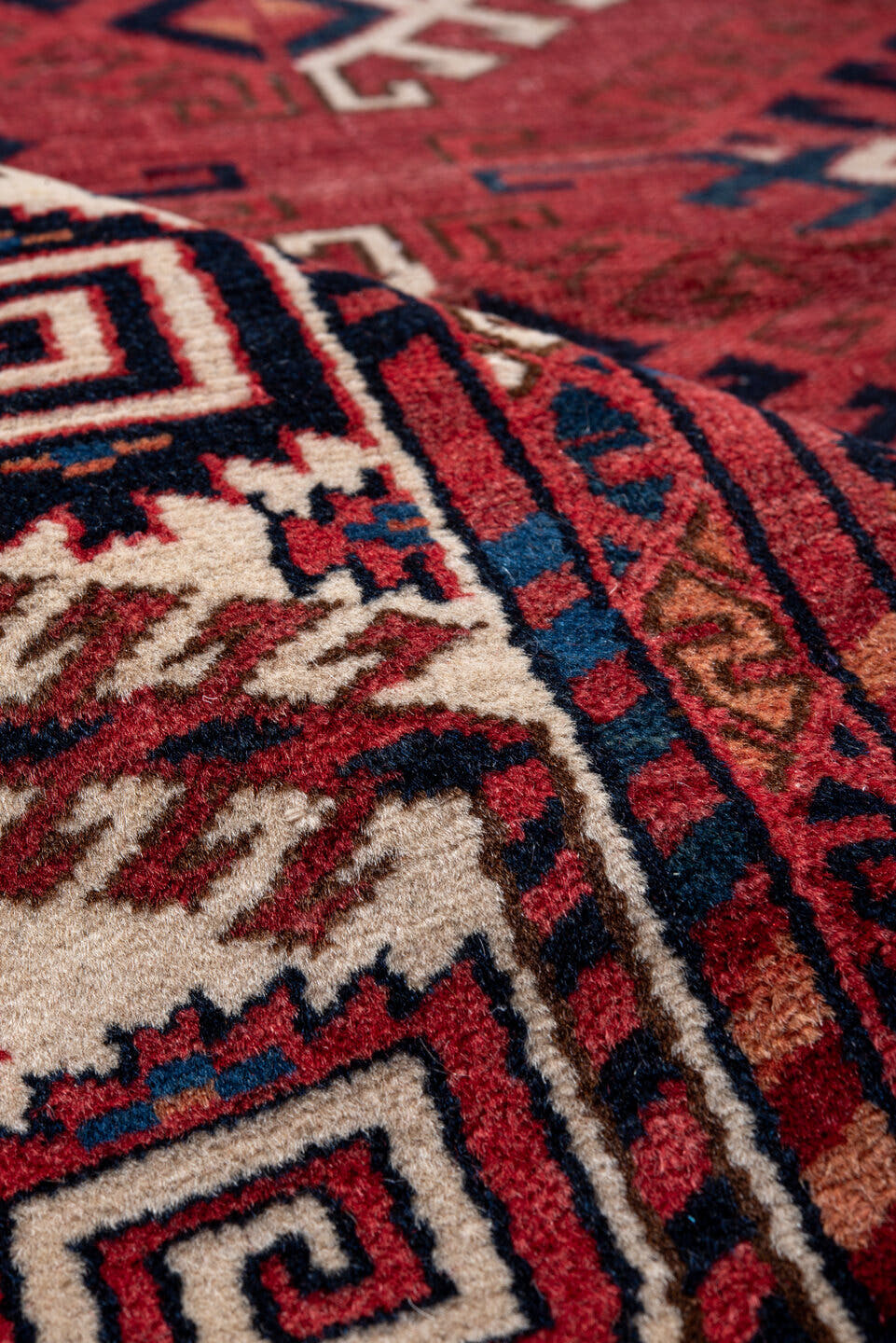 4' x 5' one-of-a-kind handmade vintage Bokara small size rug. Color palette: red, ivory, navy, burgundy, rust, cobalt, black