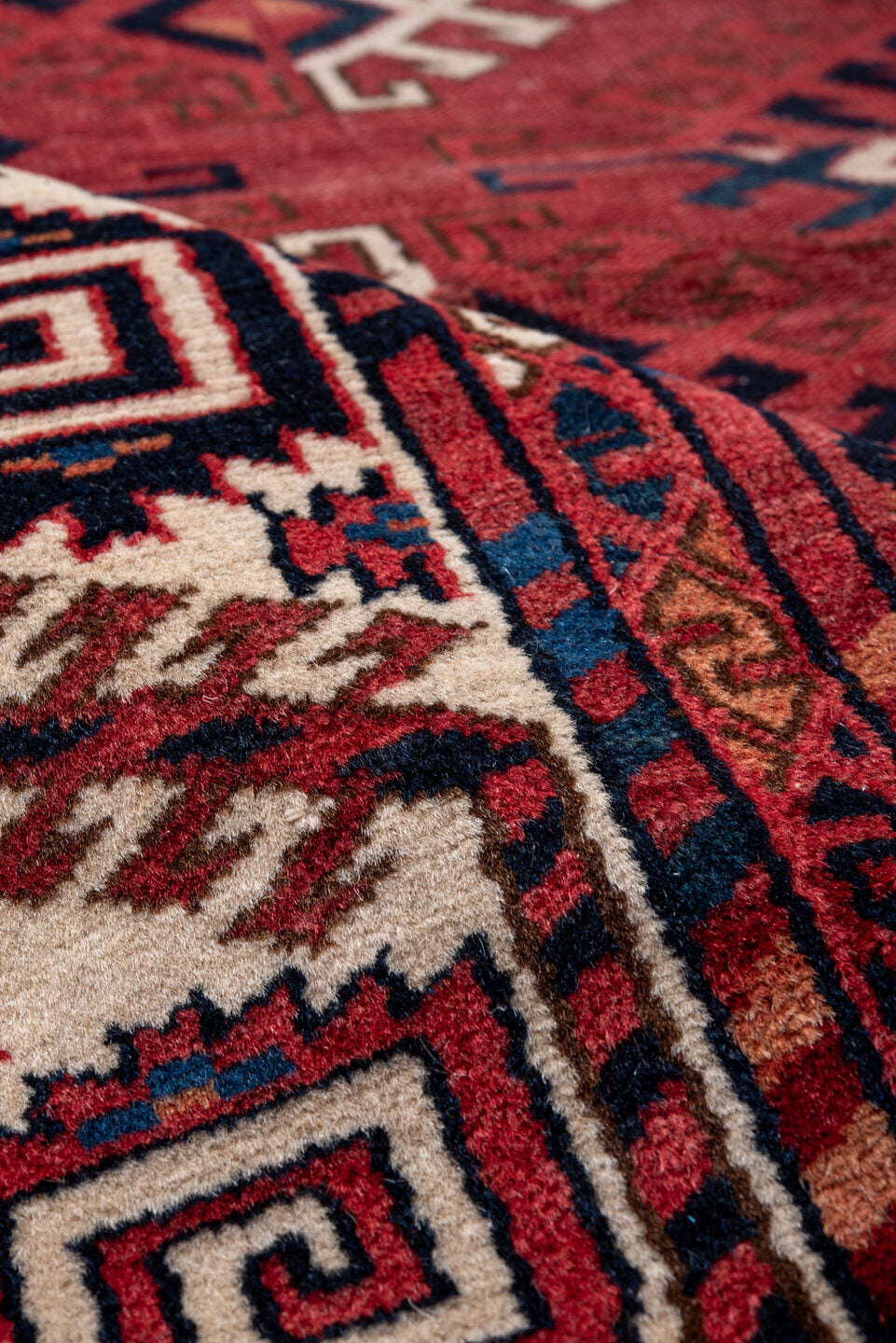 4' x 5' one-of-a-kind handmade vintage Bokara small size rug. Color palette: red, ivory, navy, burgundy, rust, cobalt, black