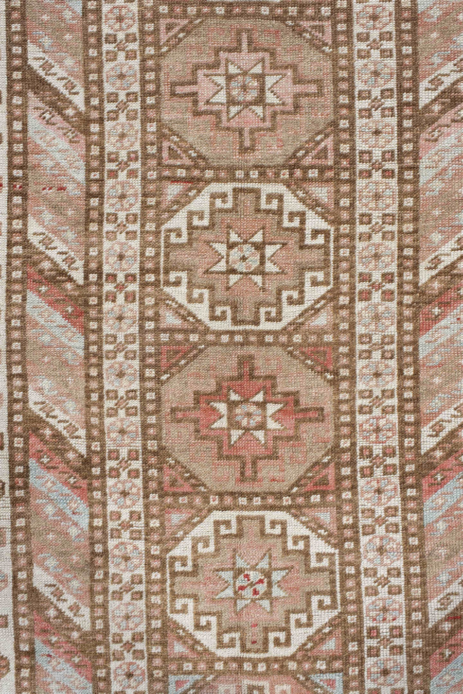 4' x 10' one-of-a-kind handmade antique Caucasian runner rug. Color palette: ivory, taupe, rose, rust, camel, brown, beige