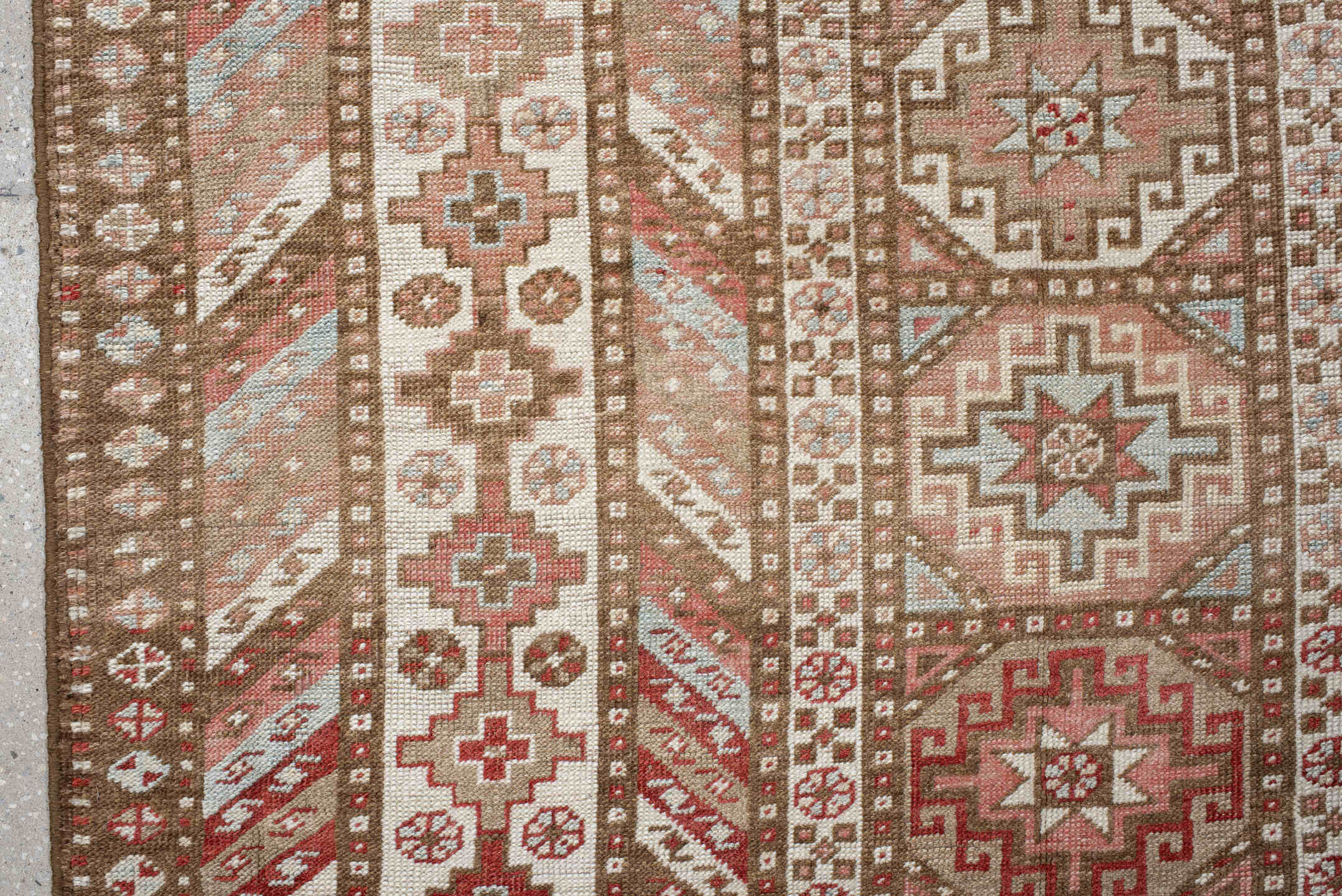 4' x 10' one-of-a-kind handmade antique Caucasian runner rug. Color palette: ivory, taupe, rose, rust, camel, brown, beige