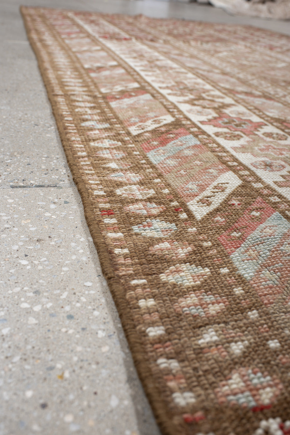 4' x 10' one-of-a-kind handmade antique Caucasian runner rug. Color palette: ivory, taupe, rose, rust, camel, brown, beige