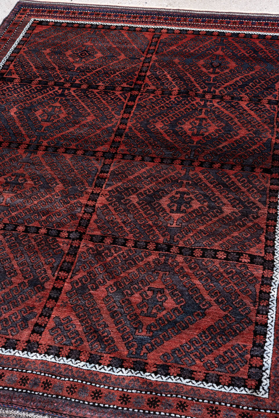 4' x 6' one-of-a-kind handmade vintage Belouch small size rug. Color palette: rust, navy, burgundy, ivory, charcoal