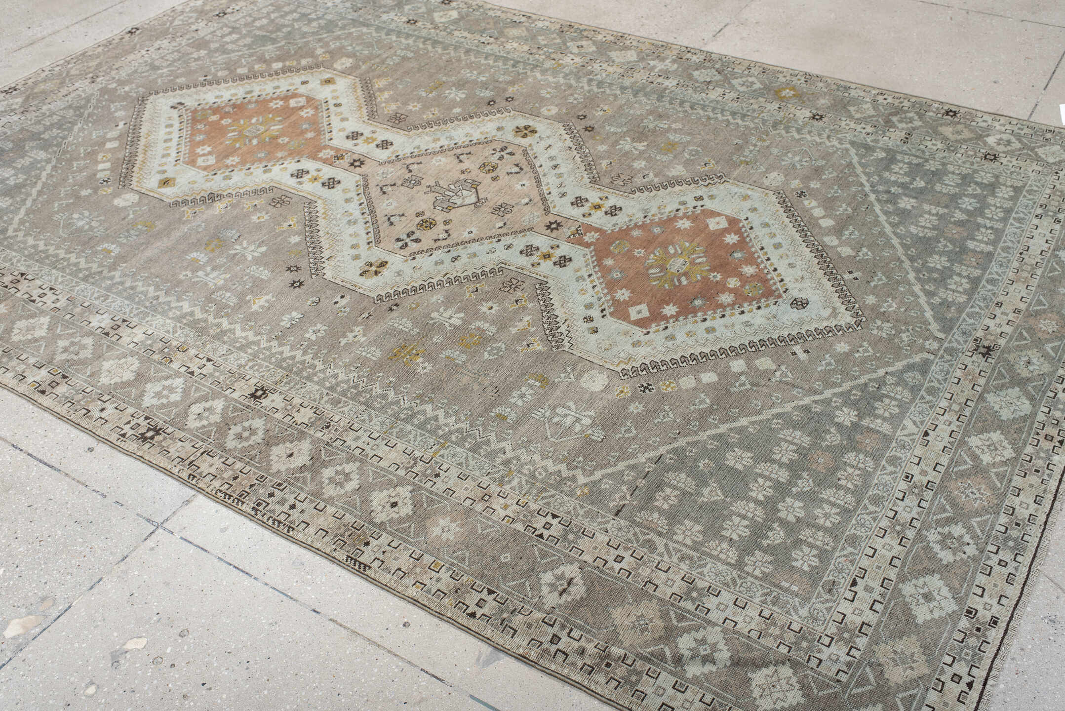 6' x 10' one-of-a-kind handmade antique Qashqai large size rug. Color palette: taupe, ivory, camel, rose, gold, brown, cream
