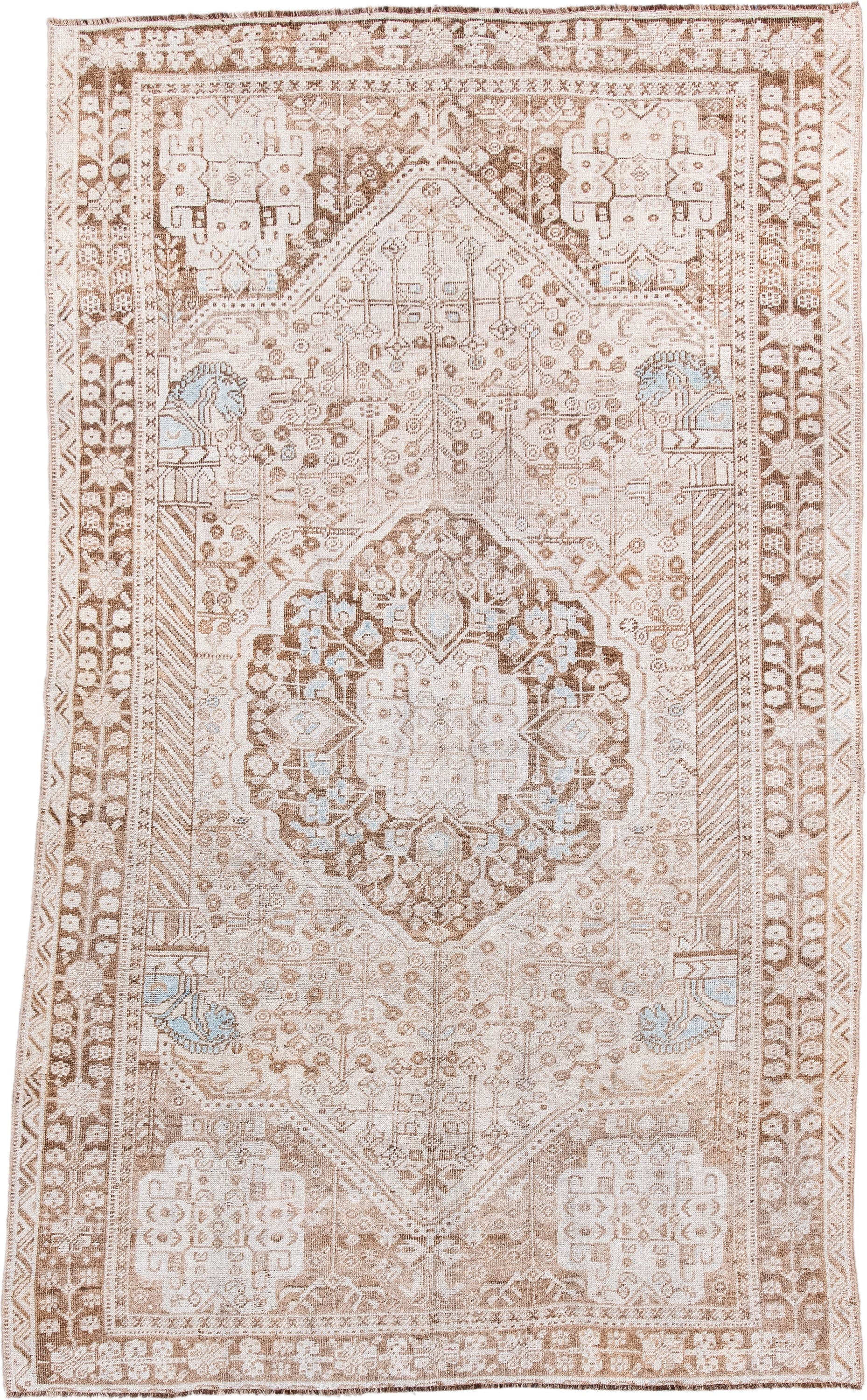 4' x 8' one-of-a-kind handmade antique Shiraz rug. Color palette: ivory, taupe, camel, pale blue, beige, light brown, gray