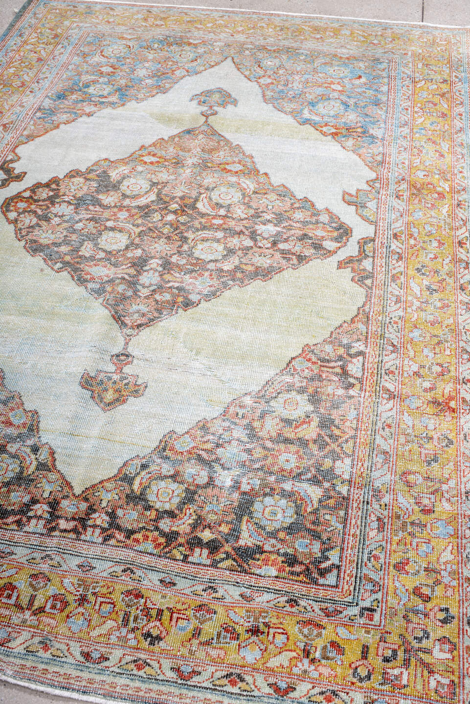 5' x 8' one-of-a-kind handmade antique Mahal medium size rug. Color palette: ivory, gold, sky blue, rust, charcoal, coral