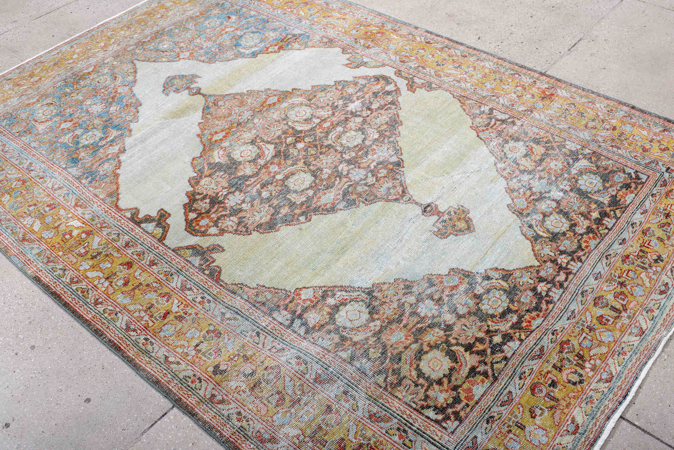 5' x 8' one-of-a-kind handmade antique Mahal medium size rug. Color palette: ivory, gold, sky blue, rust, charcoal, coral