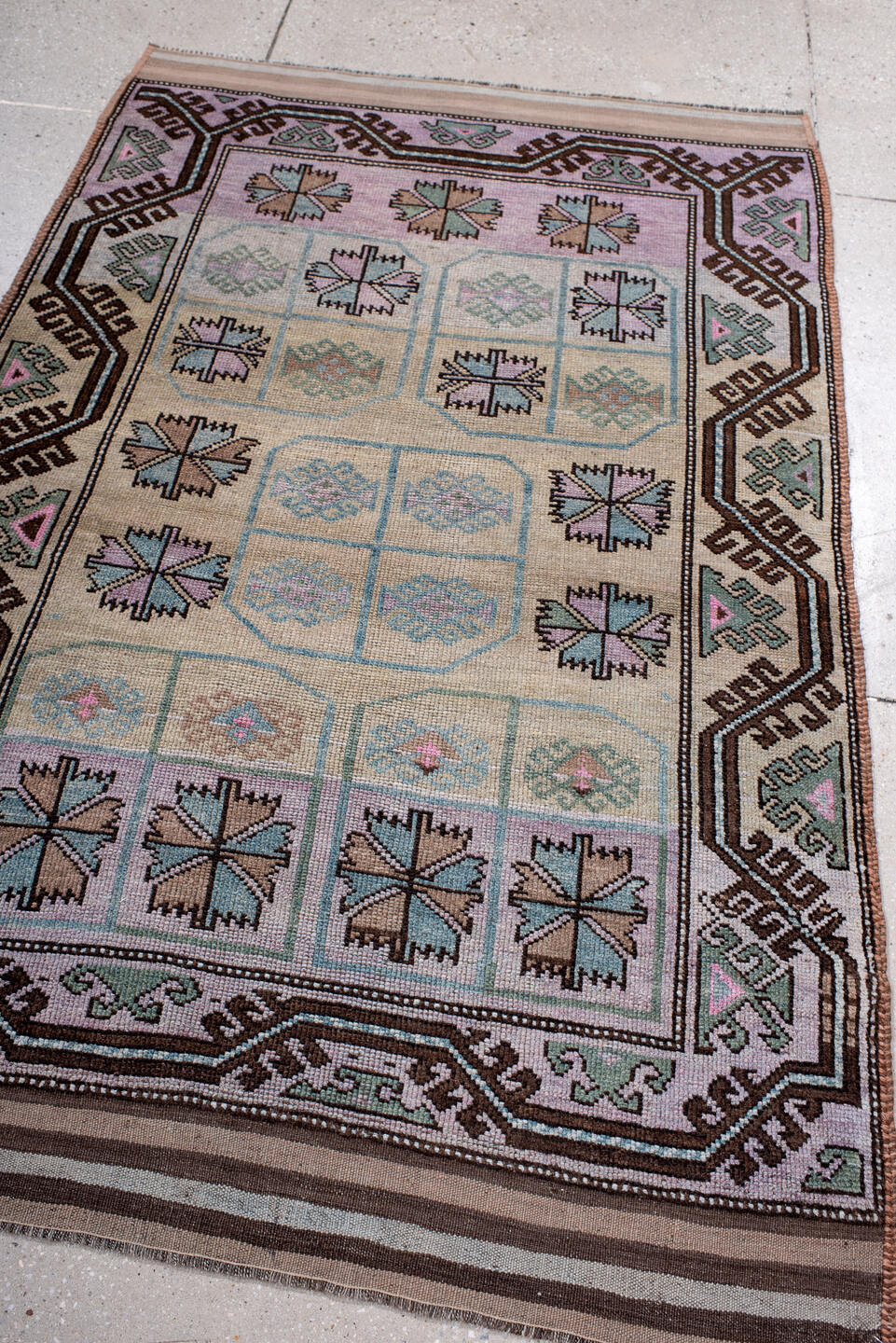 3' x 6' one-of-a-kind handmade antique Belouch small size rug. Color palette: ivory, lilac, brown, aqua, sage, taupe, pink