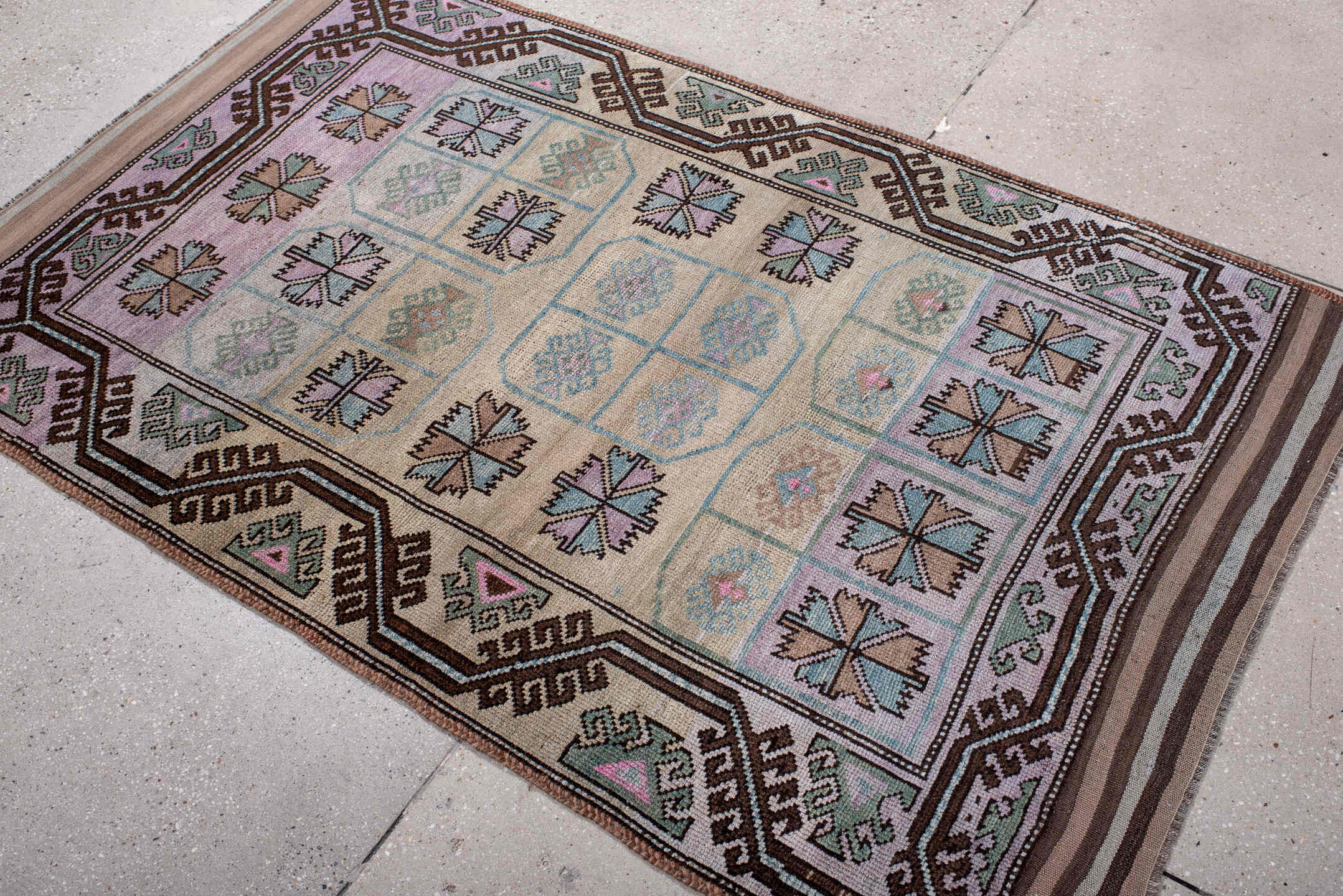 3' x 6' one-of-a-kind handmade antique Belouch small size rug. Color palette: ivory, lilac, brown, aqua, sage, taupe, pink