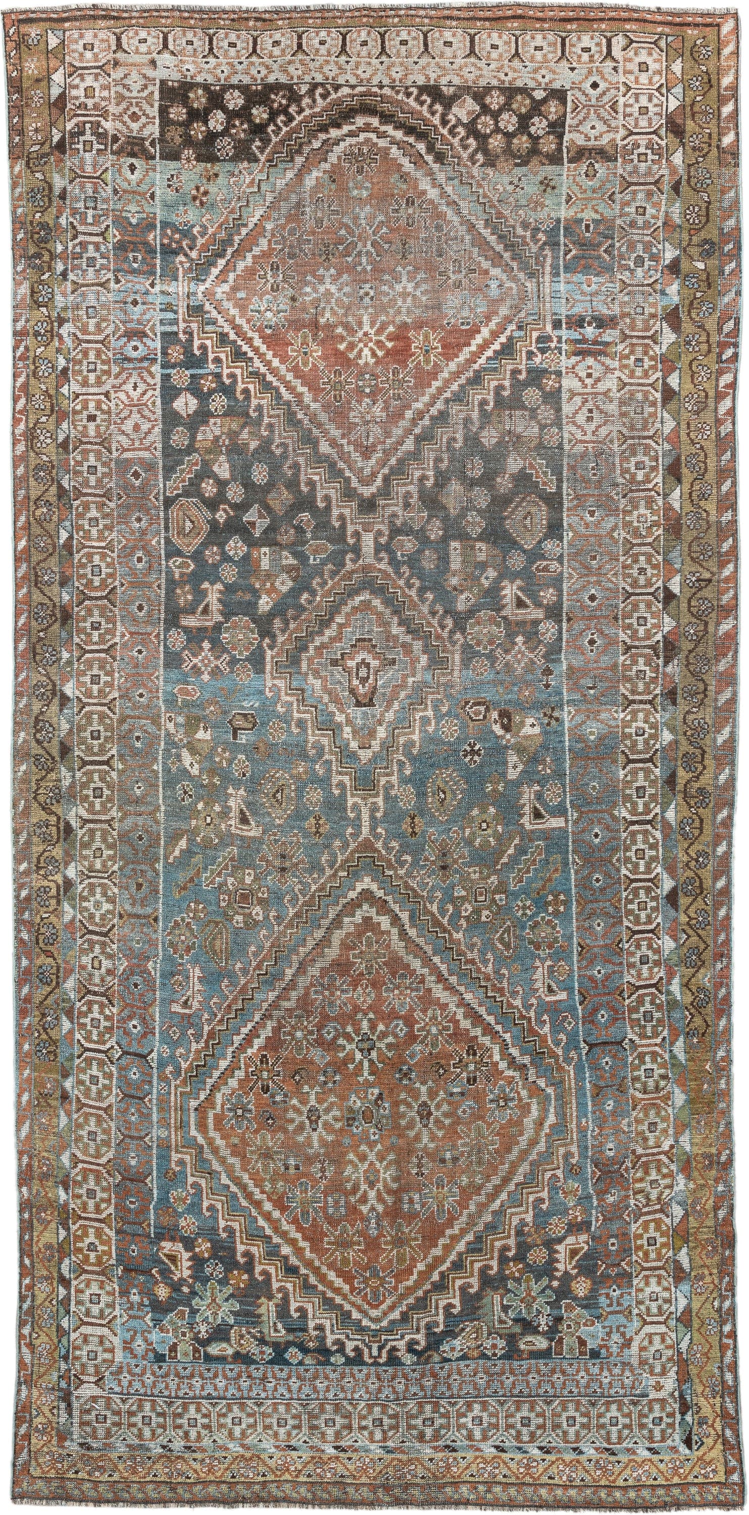 5' x 10' one-of-a-kind handmade vintage Shiraz runner rug. Color palette: sky blue, rust, ivory, brown, camel, charcoal