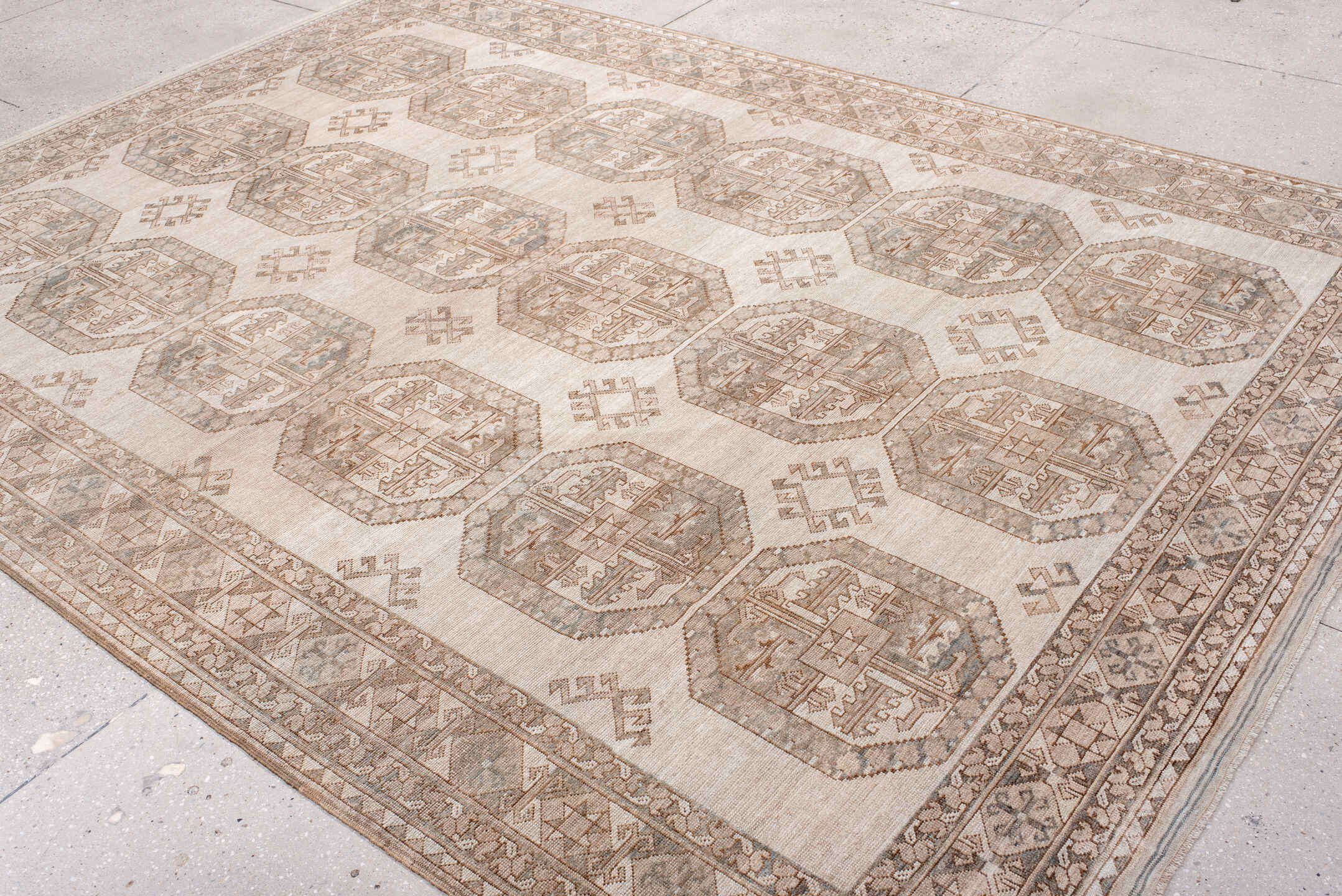 7' x 10' one-of-a-kind handmade antique Afghan large size rug. Color palette: ivory, taupe, sand, sage, camel, pewter, beige
