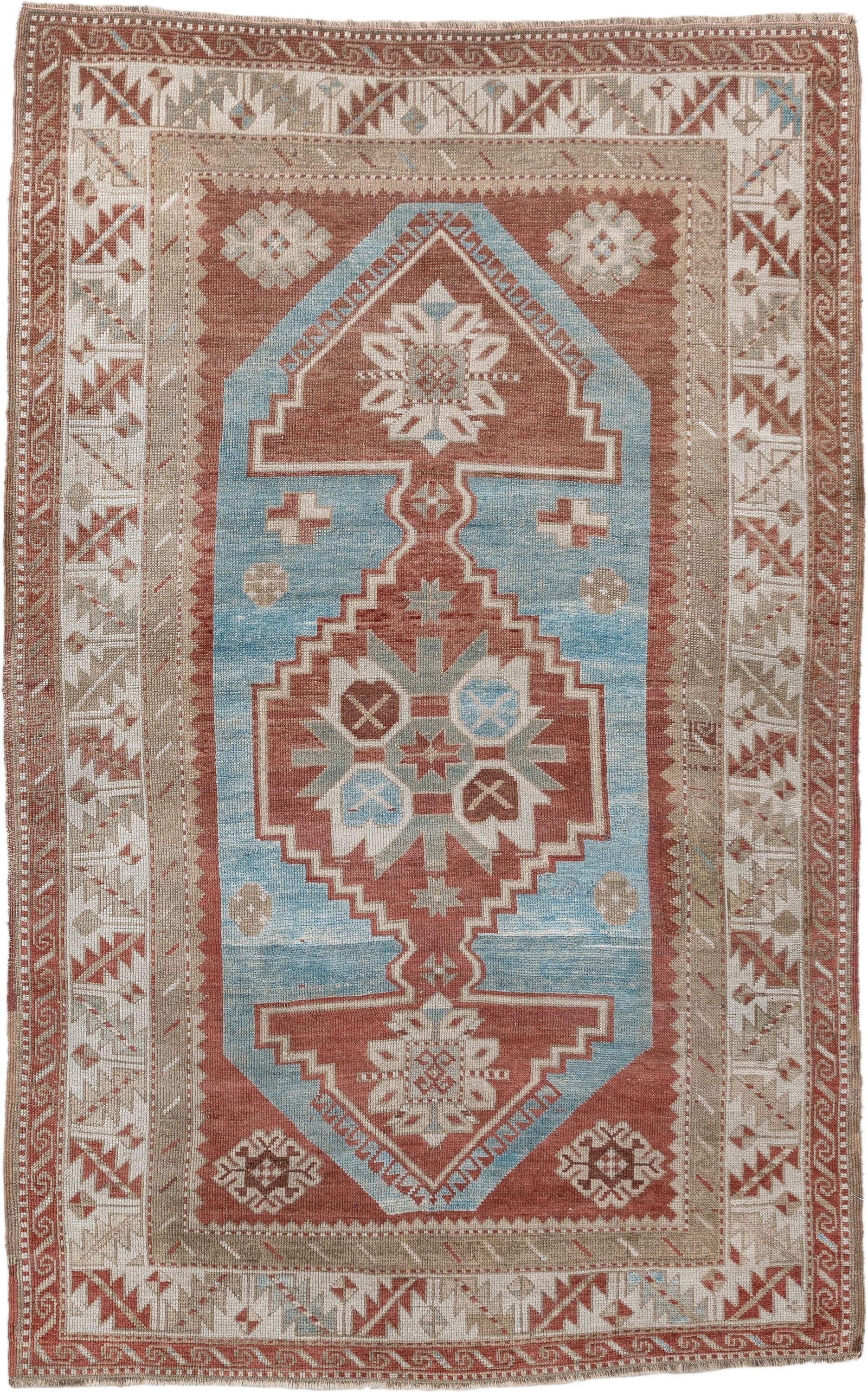 6' x 4' one-of-a-kind handmade antique Caucasian rug. Color palette: terracotta, ivory, sky blue, taupe, camel, brown