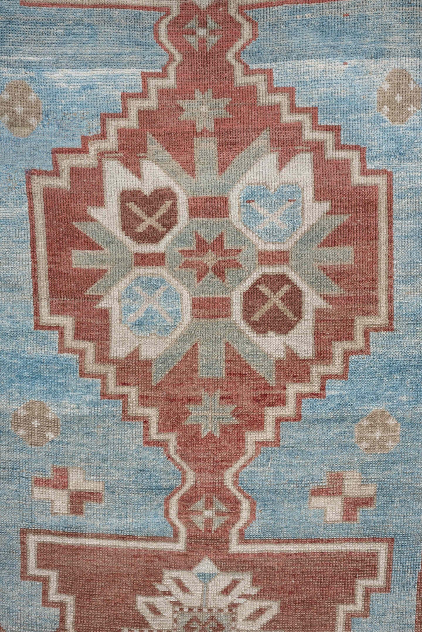 6' x 4' one-of-a-kind handmade antique Caucasian rug. Color palette: terracotta, ivory, sky blue, taupe, camel, brown
