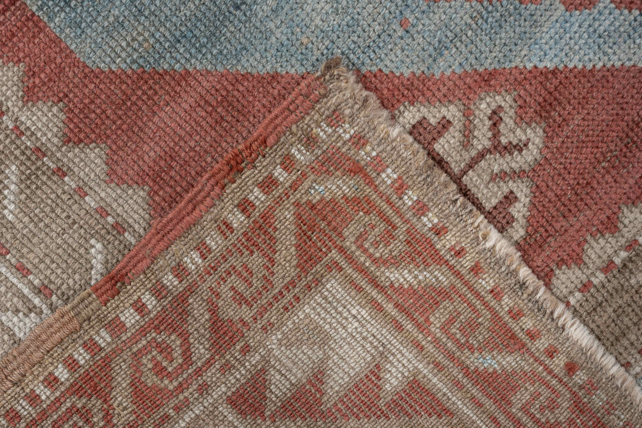 6' x 4' one-of-a-kind handmade antique Caucasian rug. Color palette: terracotta, ivory, sky blue, taupe, camel, brown