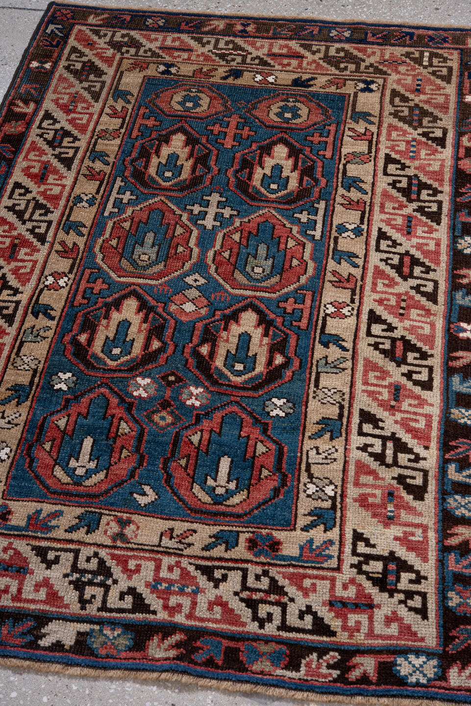 2' x 4' one-of-a-kind handmade vintage Caucasian small size rug. Color palette: blue, ivory, rust, brown, navy, pink, black